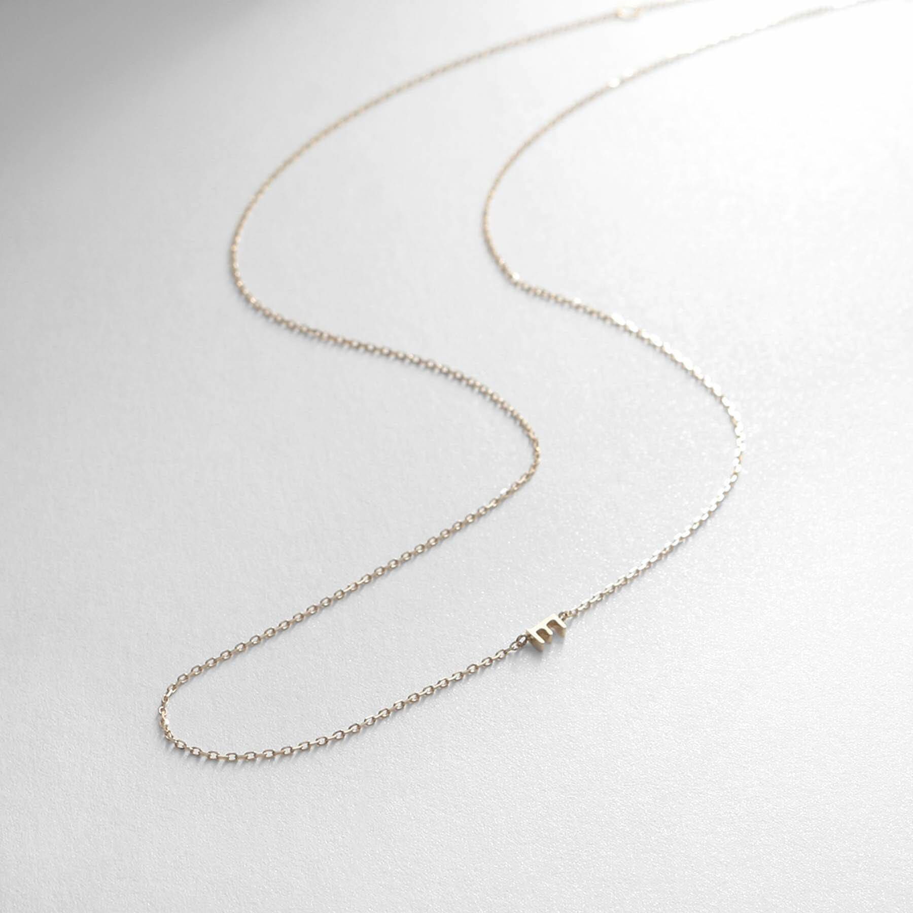 COCOSHNIK「【WEB限定】K10イニシャルＥ ネックレス」|ネックレス|イエローゴールド(1