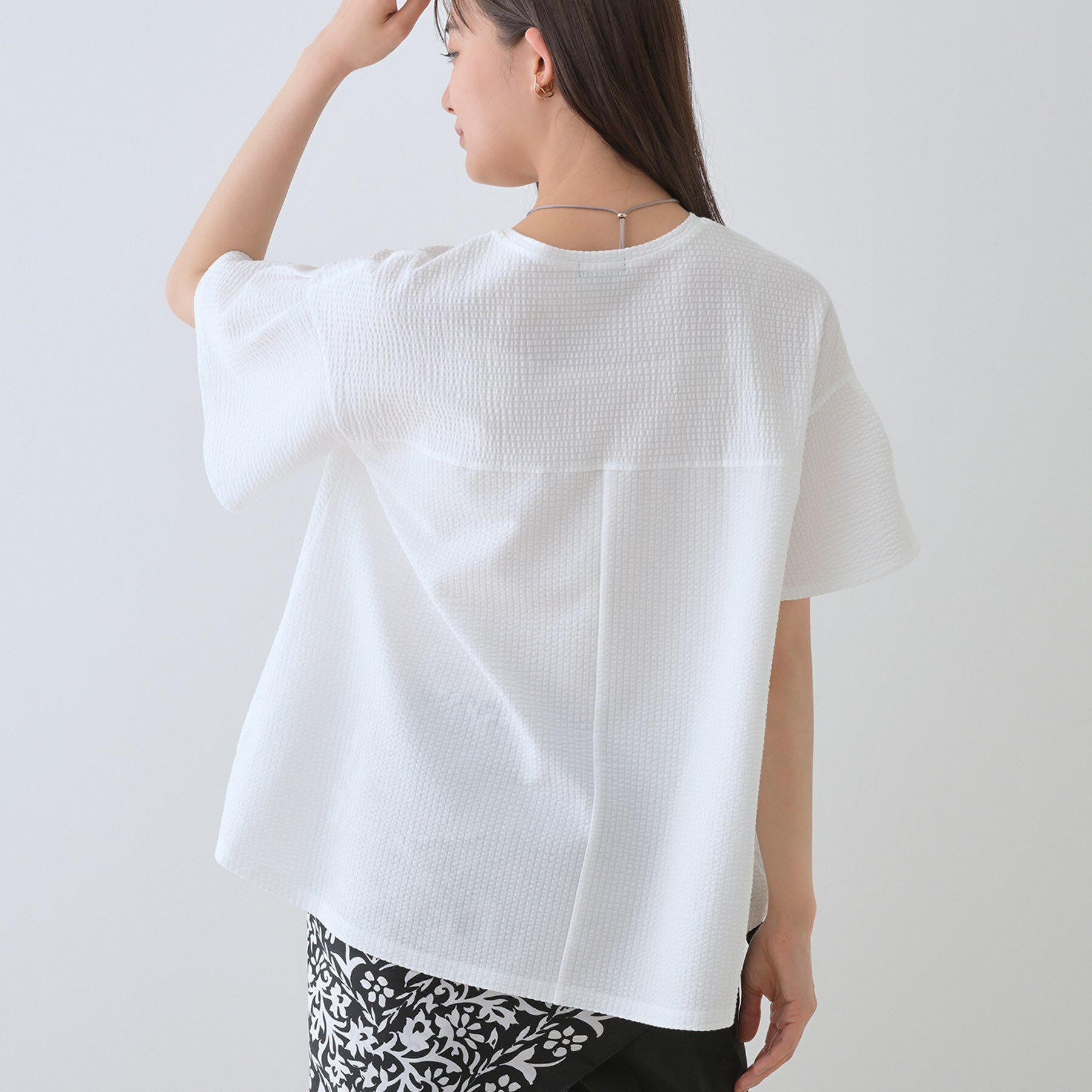 INDIVI「【洗える／体型カバー】凹凸素材フレアデザイントップス」|Tシャツ・カットソー|