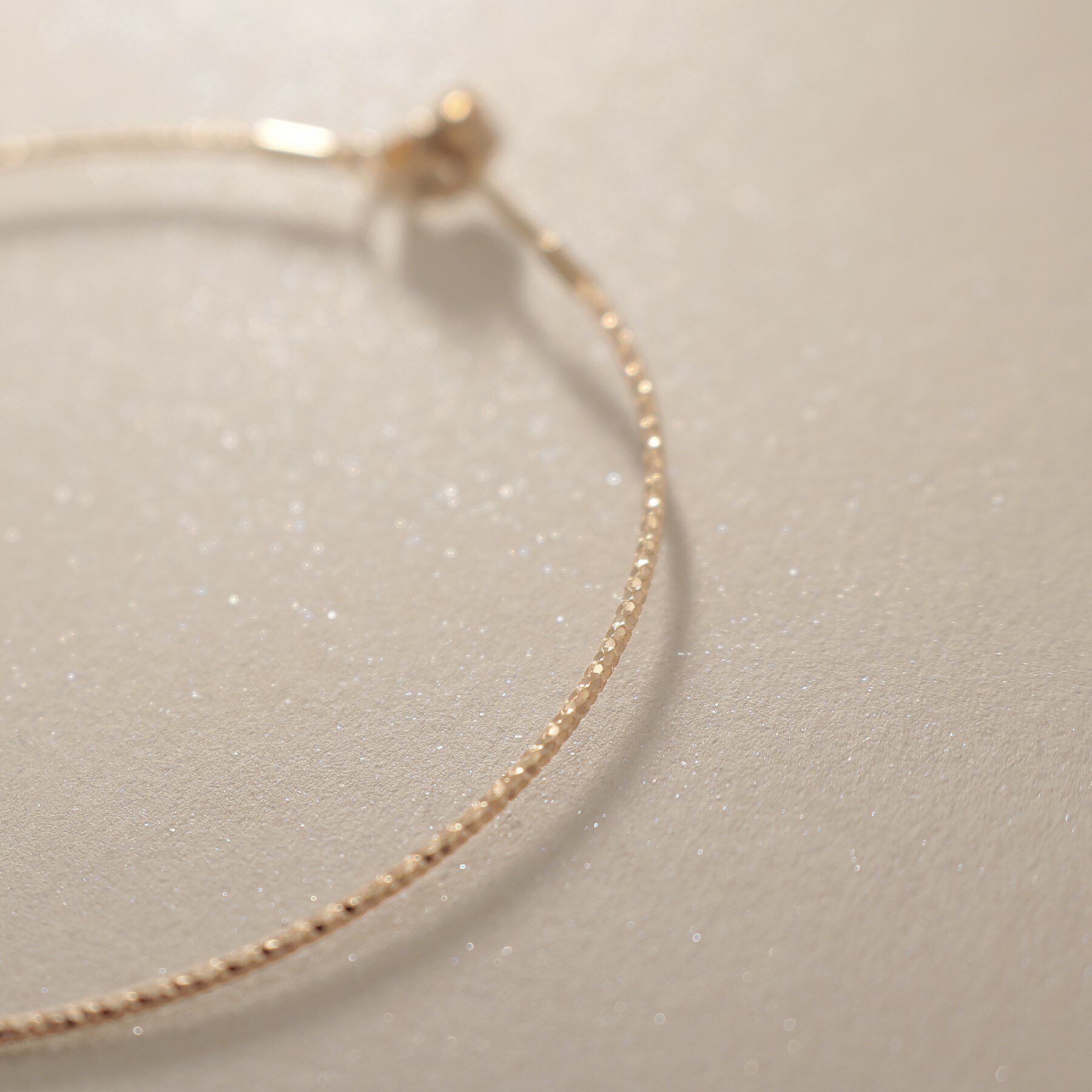 COCOSHNIK「K10カット丸線 フープピアス（中）」|ピアス|