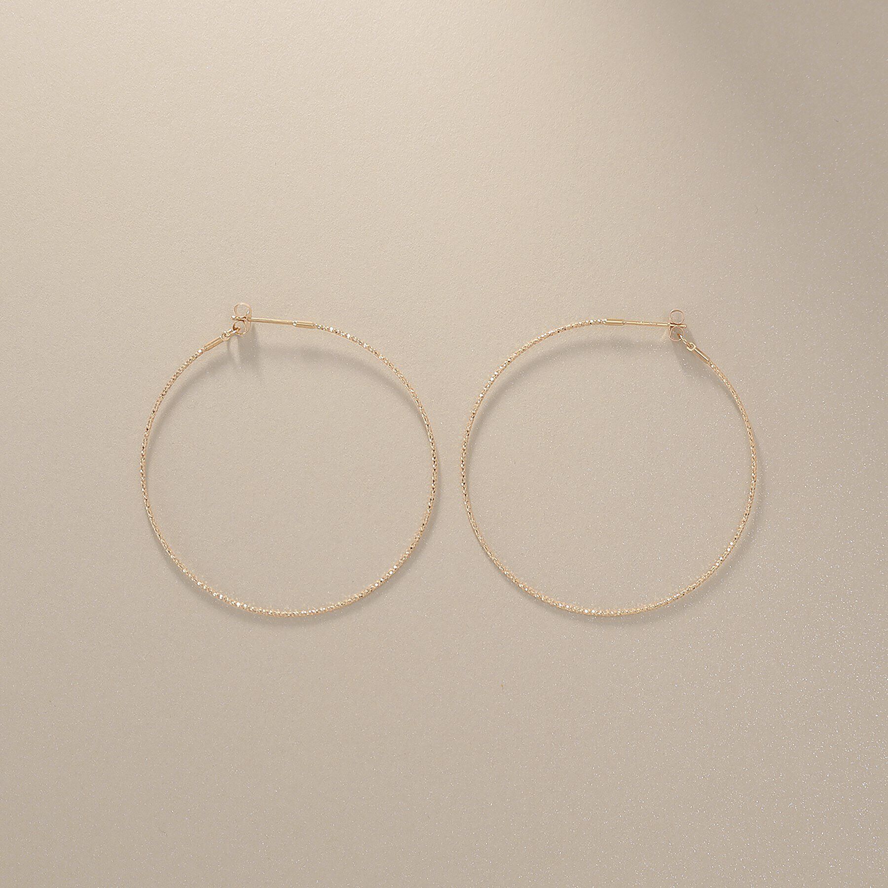 COCOSHNIK「K10カット丸線 フープピアス（中）」|ピアス|