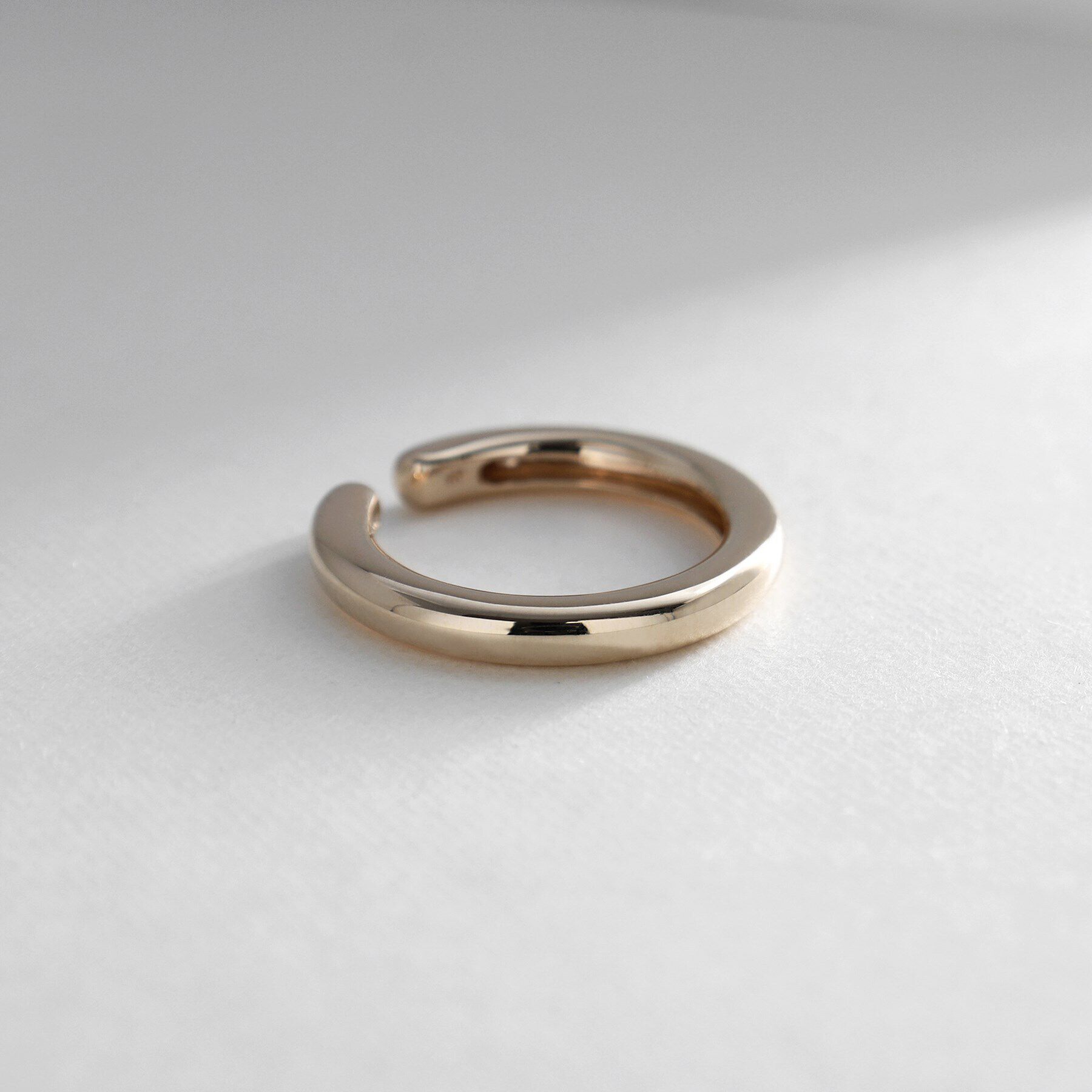 COCOSHNIK「K10丸線ボリューム イヤーカフ大」|イヤリング|