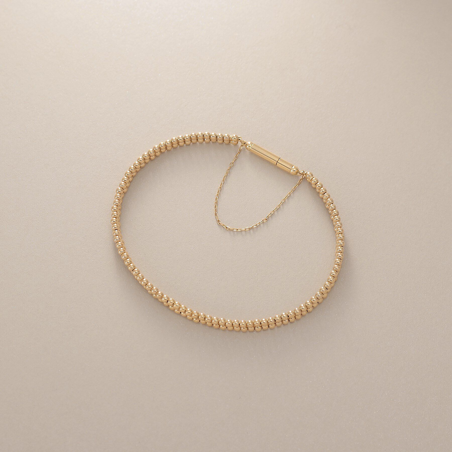 COCOSHNIK「K18丸玉2連マグネット バングル」|ブレスレット・バングル|