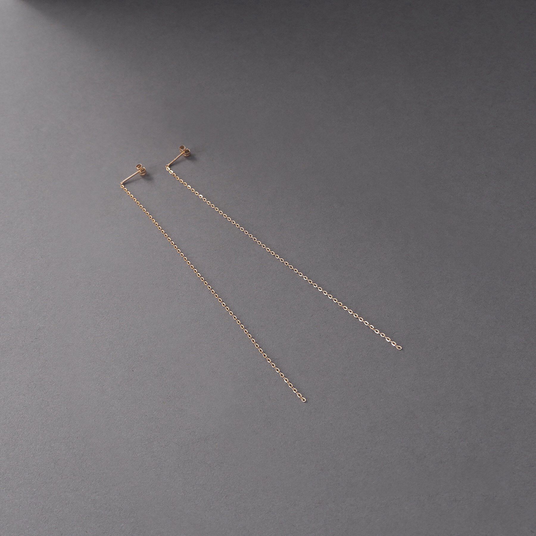 COCOSHNIK ONKITSCH「K10チェーンピアス フラッシュケーブル」|ピアス|