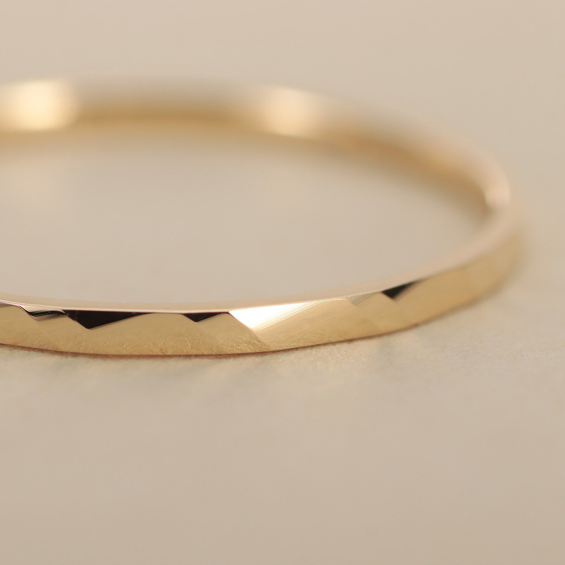 COCOSHNIK ONKITSCH「K10スキニーリング ダイアゴナルカット」|リング|