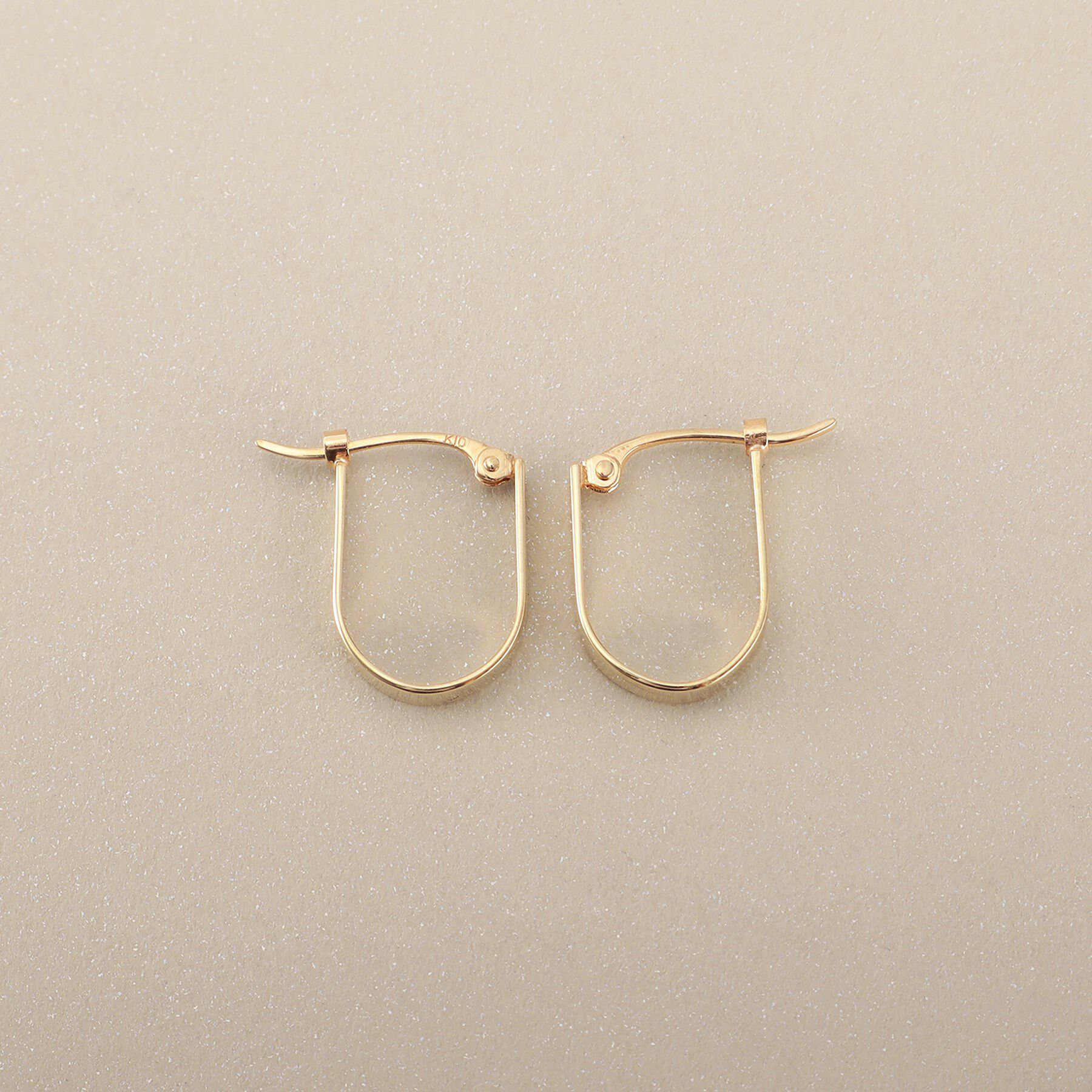 COCOSHNIK「K10平打ち楕円 フープピアス」|ピアス|