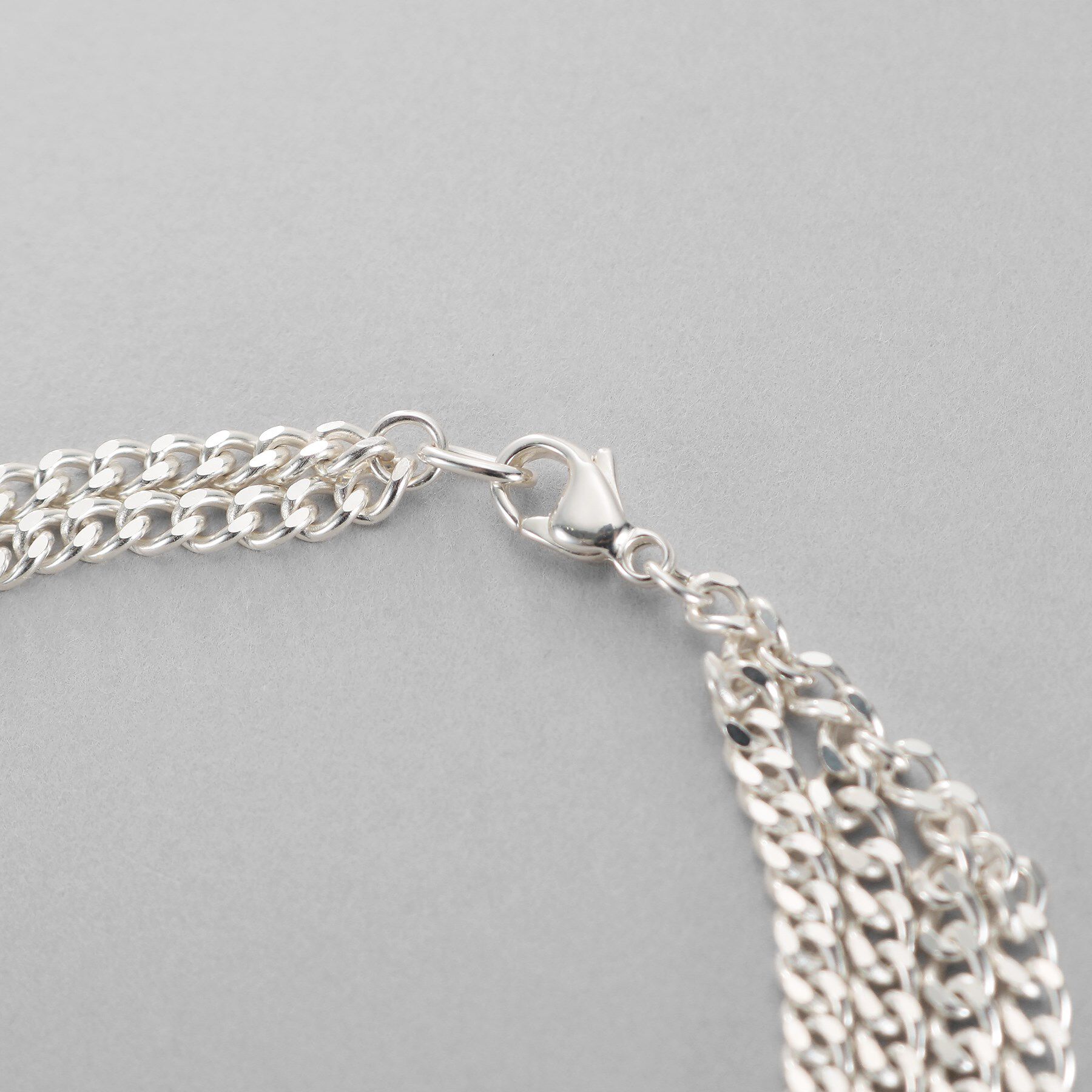 COCOSHNIK ONKITSCH「シルバー カーブチェーンアシンメトリードレープブレスレット」|ブレスレット・バングル|