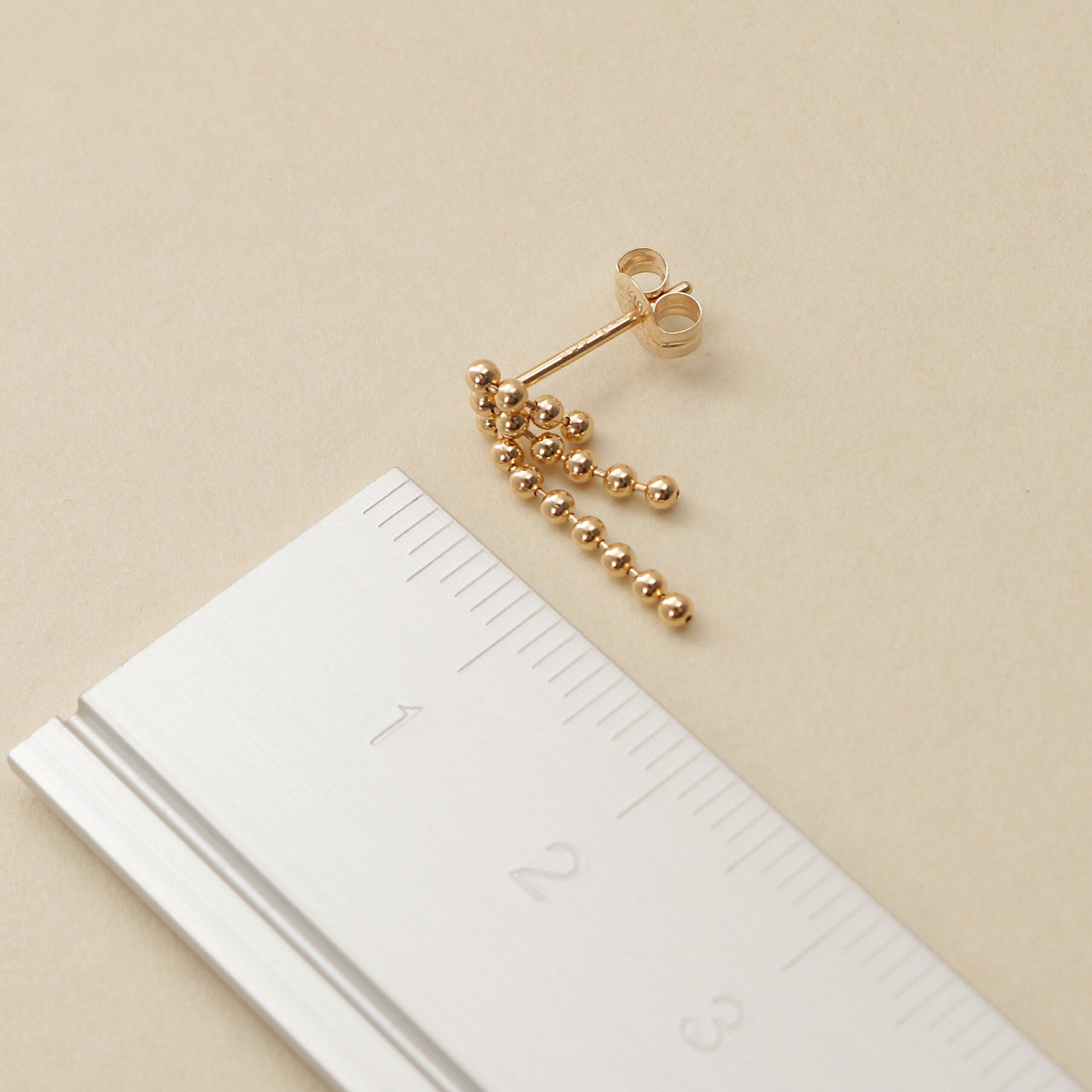 COCOSHNIK ONKITSCH「K10ティアボールチェーンピアス」|ピアス|