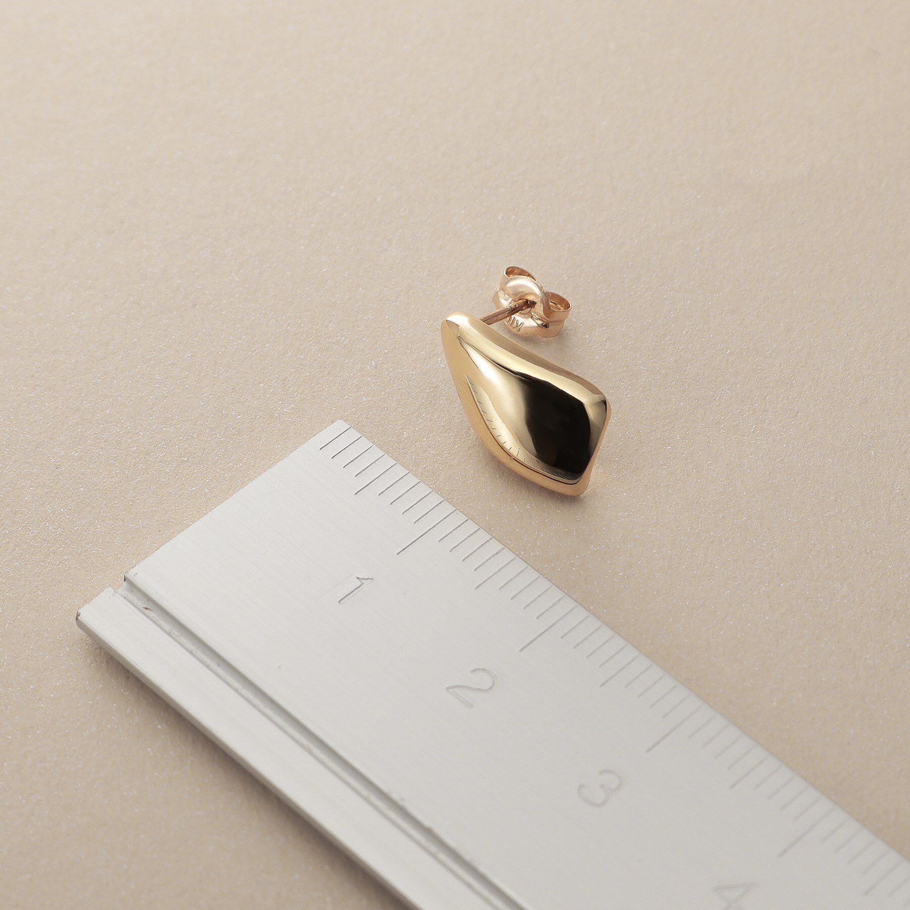 COCOSHNIK「K10甲丸ラップ スタッズピアス」|ピアス|