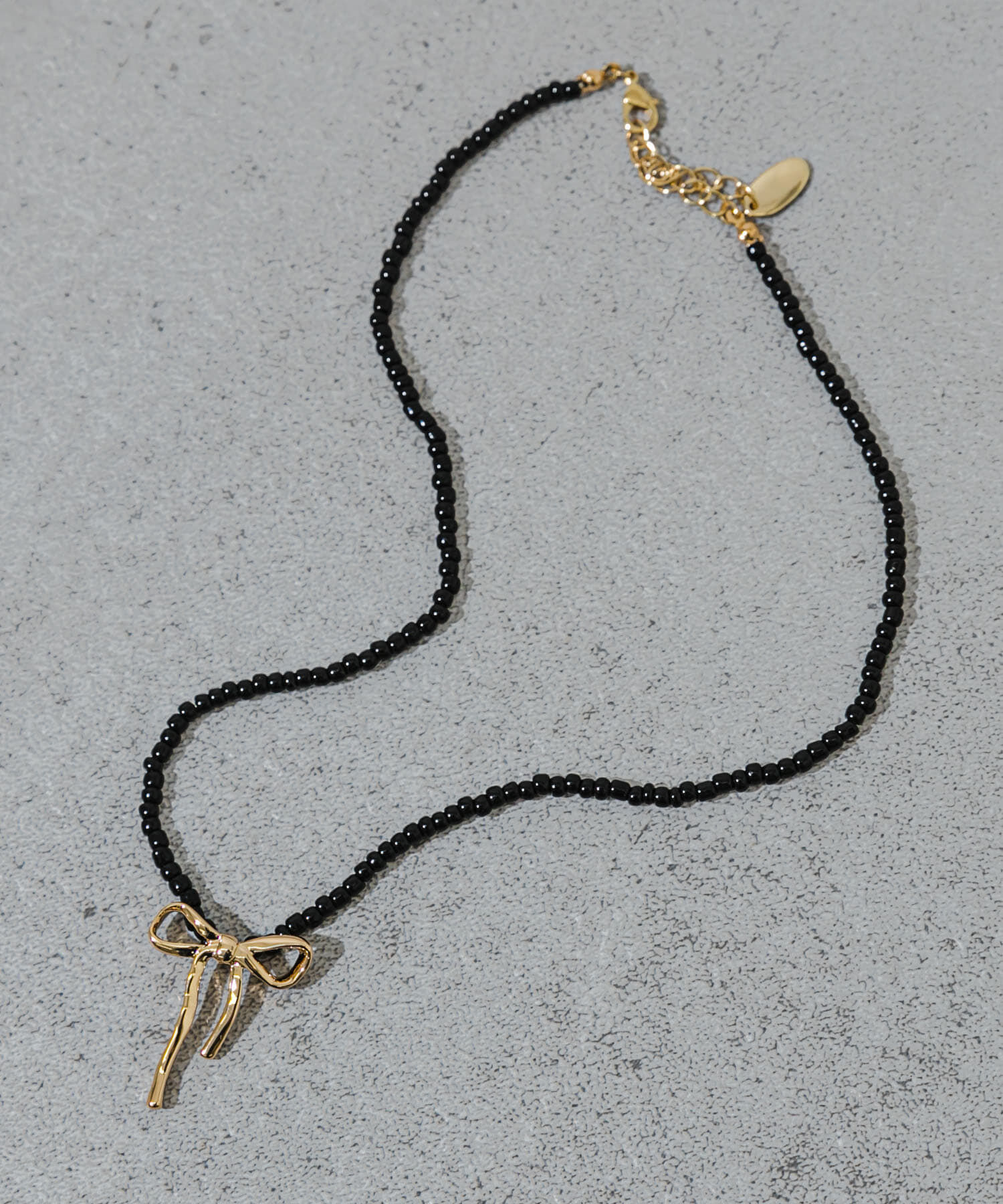 SMELLY「ビーズメタルリボントップネックレス」|ネックレス|ブラック