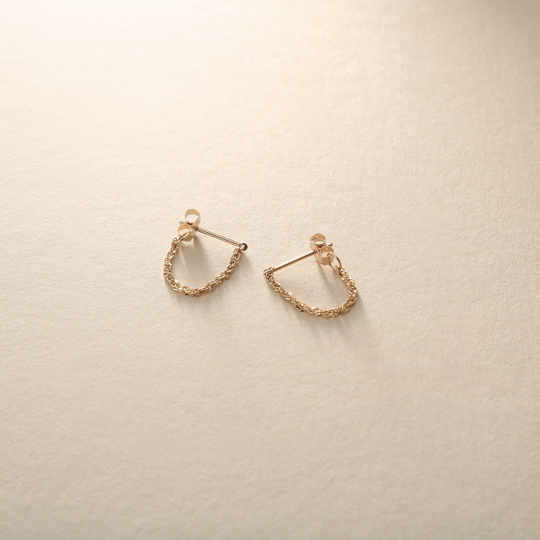 COCOSHNIK ONKITSCH「K10スクリューチェーン フープピアス」|ピアス|