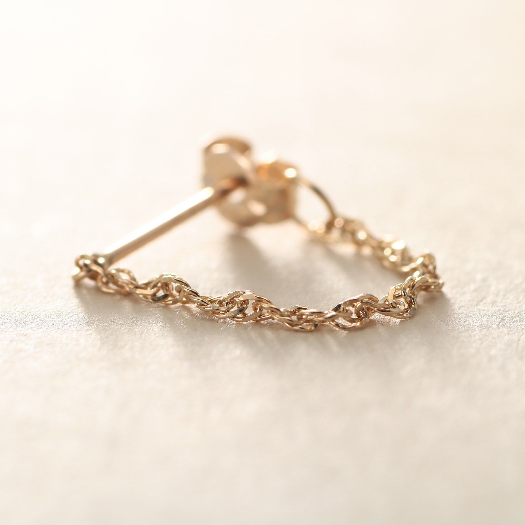 COCOSHNIK ONKITSCH「K10スクリューチェーン フープピアス」|ピアス|