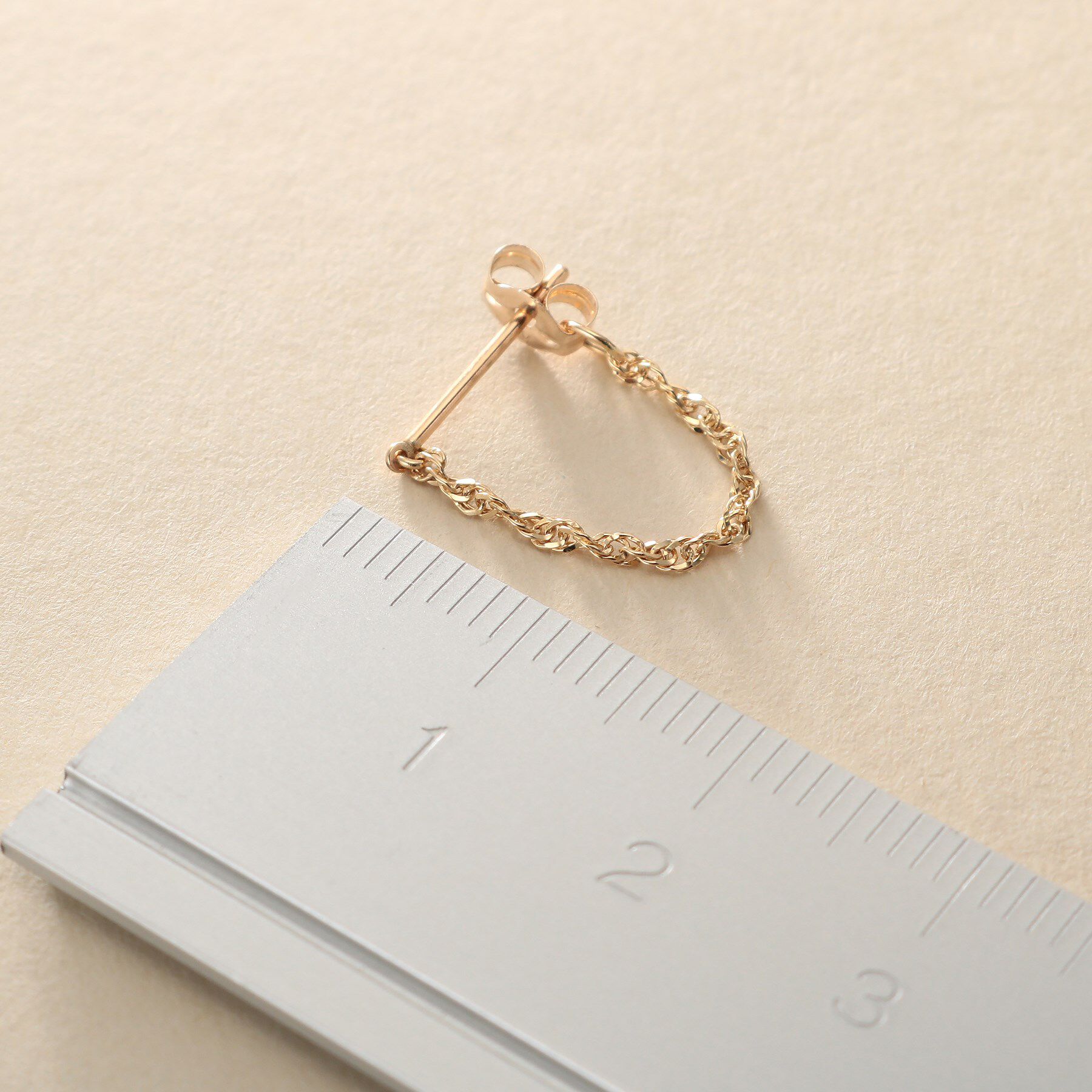 COCOSHNIK ONKITSCH「K10スクリューチェーン フープピアス」|ピアス|