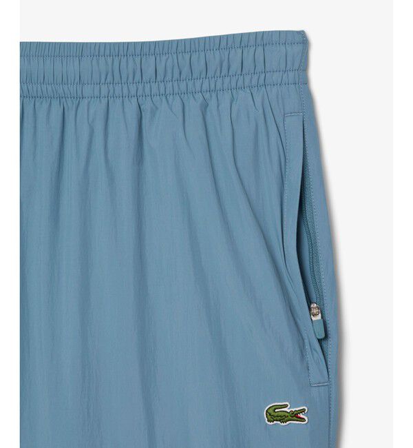 LACOSTE「ワッシャー加工 ナイロン 軽量撥水トラックパンツ」|その他|
