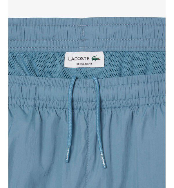 LACOSTE「ワッシャー加工 ナイロン 軽量撥水トラックパンツ」|その他|