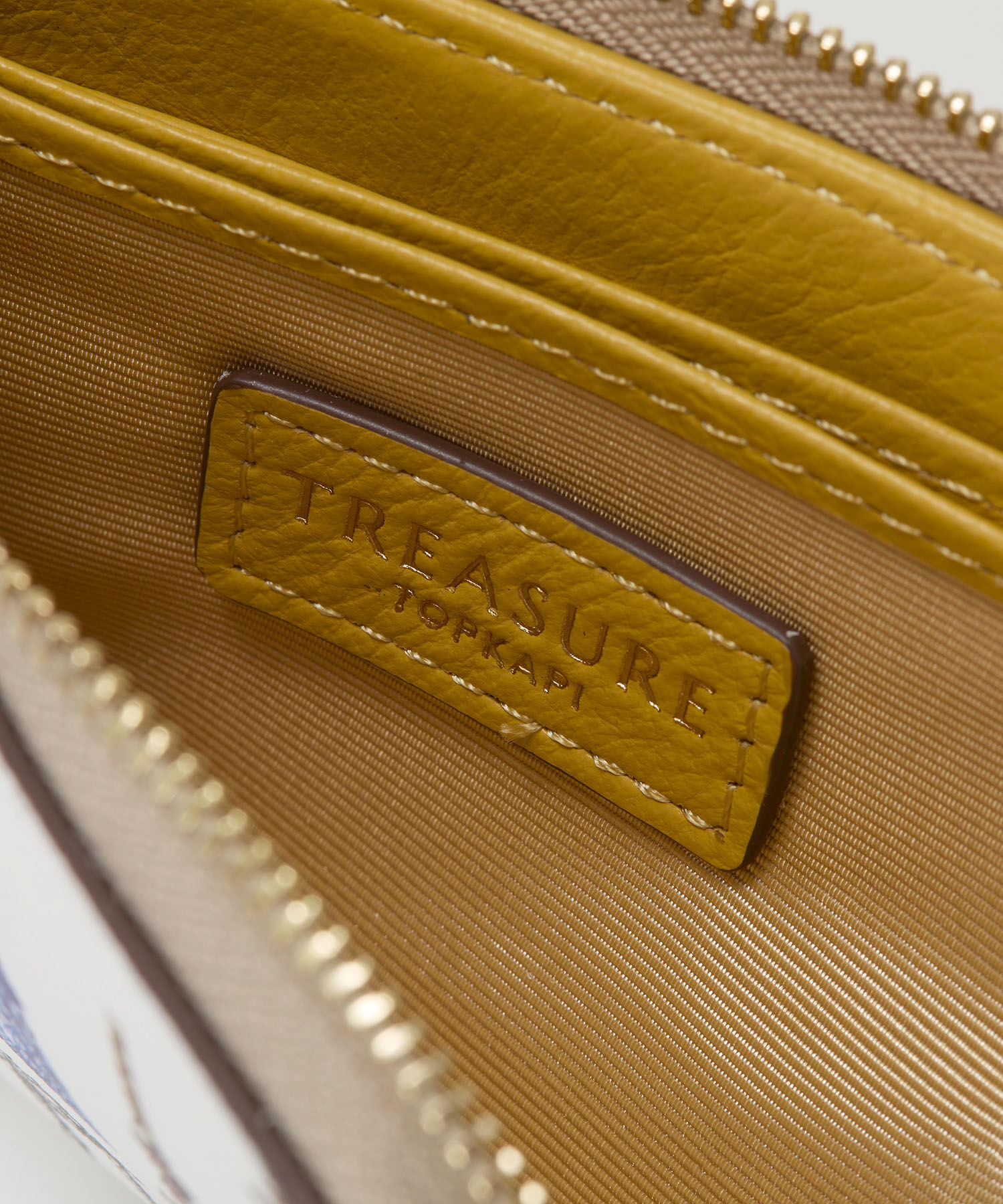 TOPKAPI TREASURE「【TREASURE TOPKAPI】シュリンクレザー タッセル プリント ラウンド 二つ折り財布」|財布|