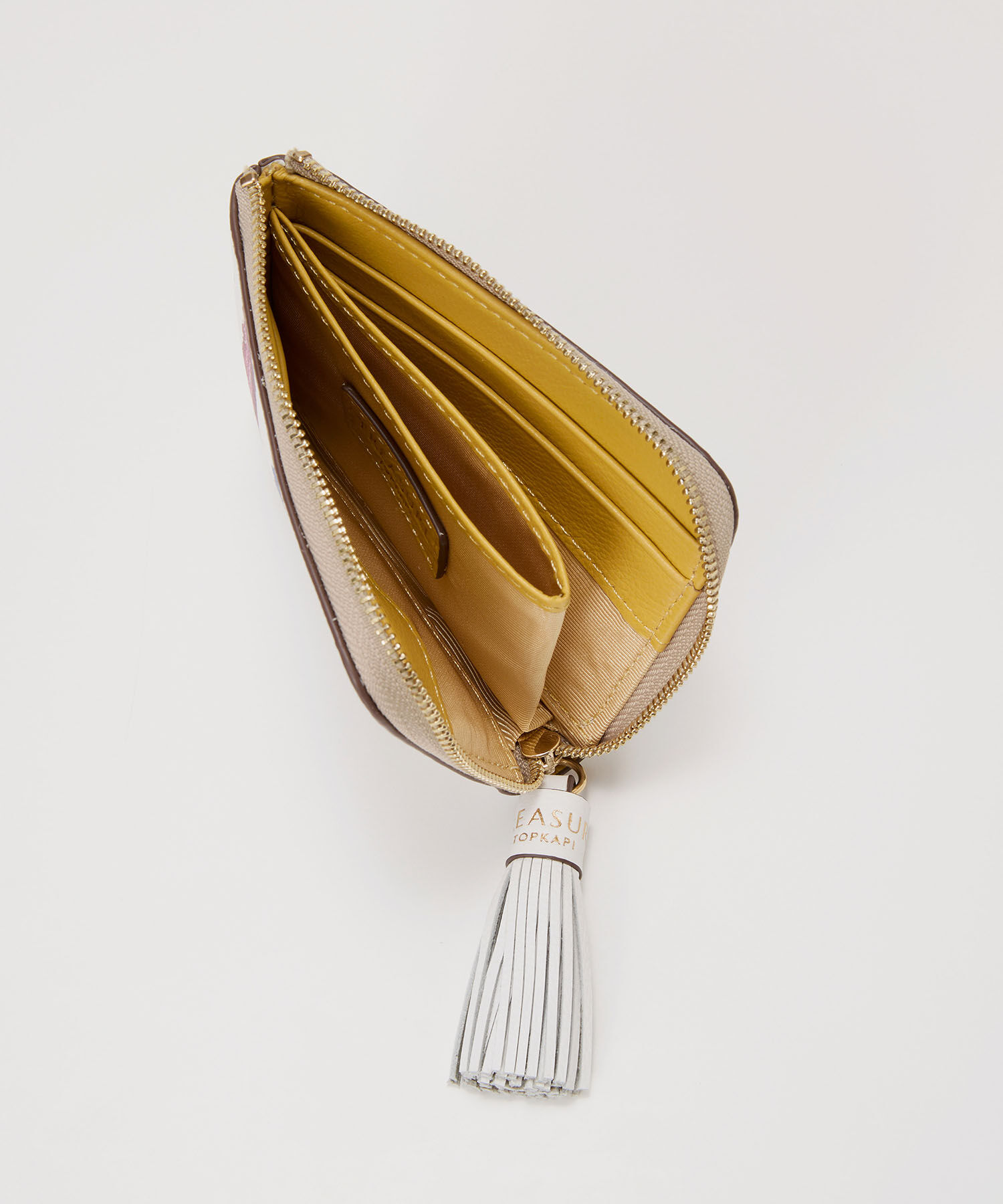 TOPKAPI TREASURE「【TREASURE TOPKAPI】シュリンクレザー タッセル プリント ラウンド 二つ折り財布」|財布|