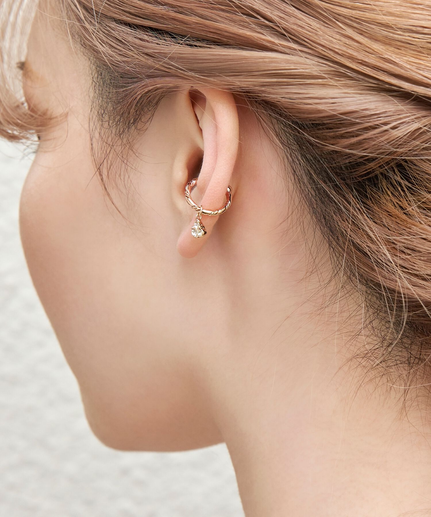 Phoebe「スパイラルラインビジューイヤーカフ　ローズゴールド」|イヤーカフ|