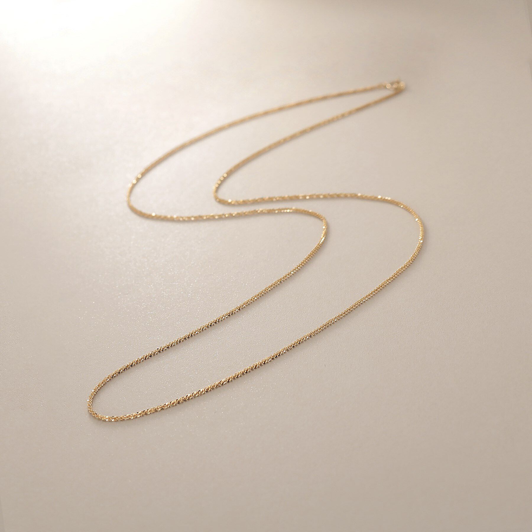 COCOSHNIK「K10クリスクロスチェーン ネックレス（60cm）」|ネックレス|