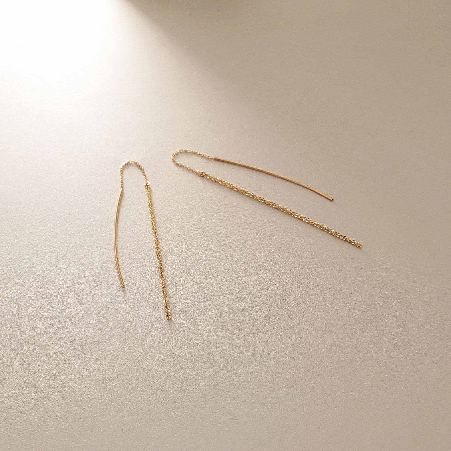 COCOSHNIK「K10クリスクロスチェーンフリンジ ピアス」|ピアス|