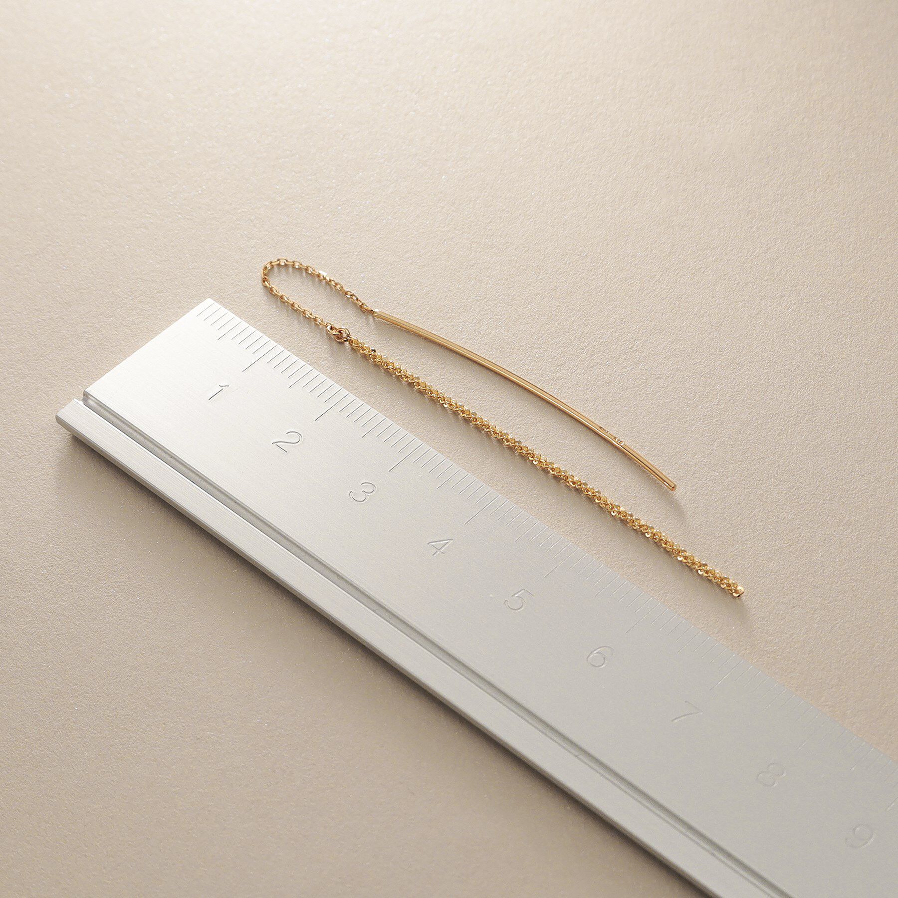 COCOSHNIK「K10クリスクロスチェーンフリンジ ピアス」|ピアス|