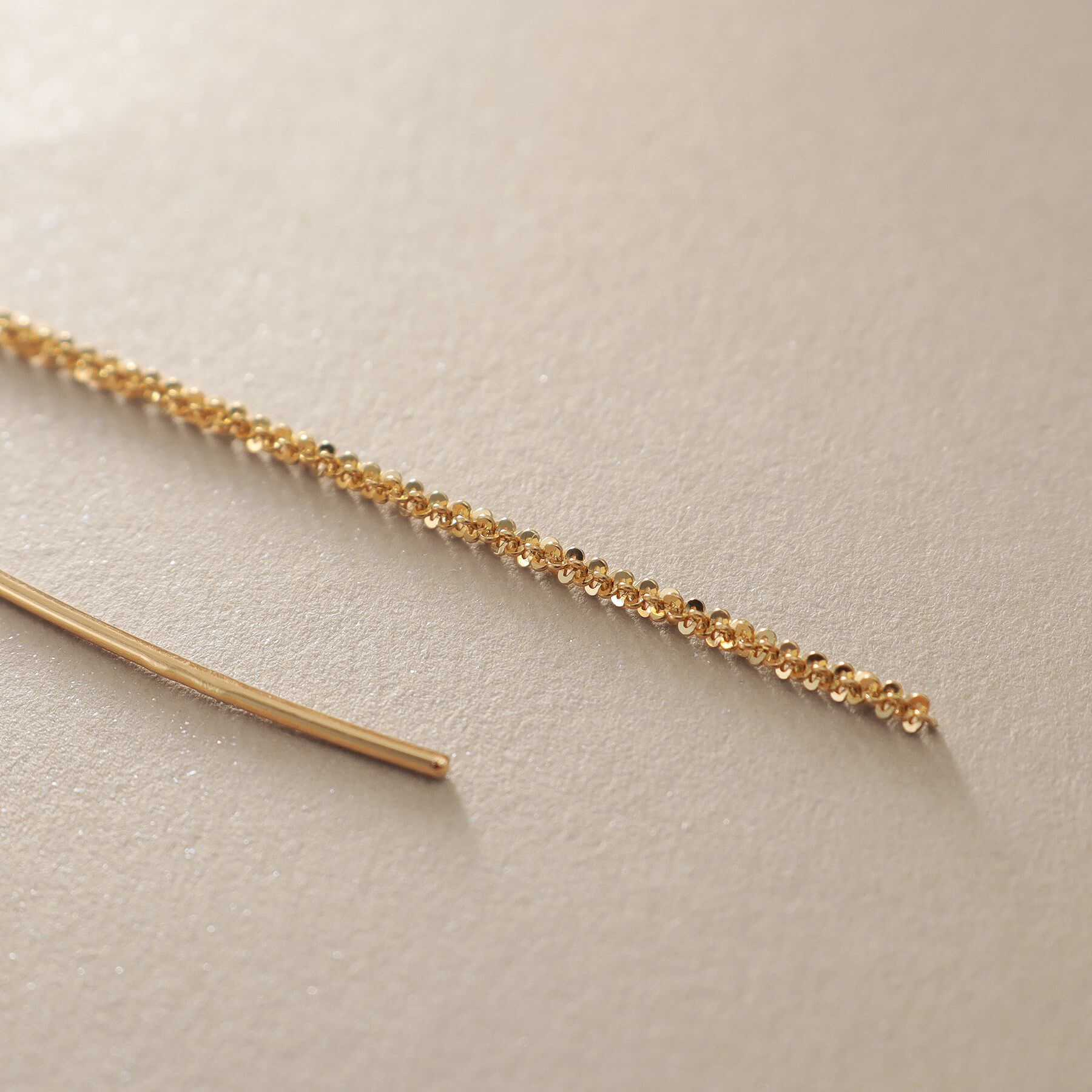 COCOSHNIK「K10クリスクロスチェーンフリンジ ピアス」|ピアス|