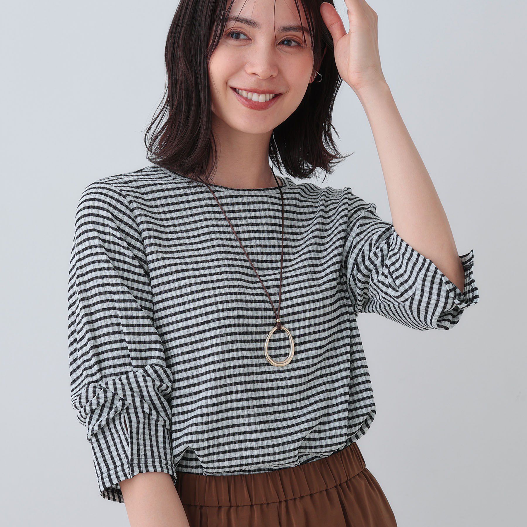 INDIVI「【洗える／吸水速乾／UVケア】ねじりデザイン袖カットソー」|Tシャツ・カットソー|ブラック(219)