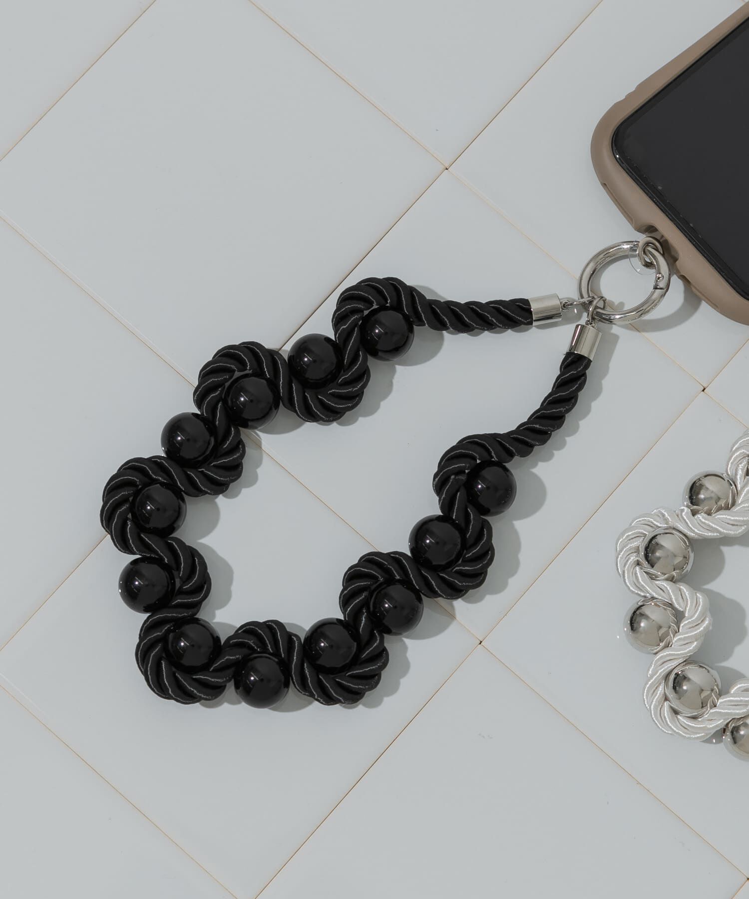 SMELLY「ツイストロープボールハンドストラップ」|モバイルケース|ブラック