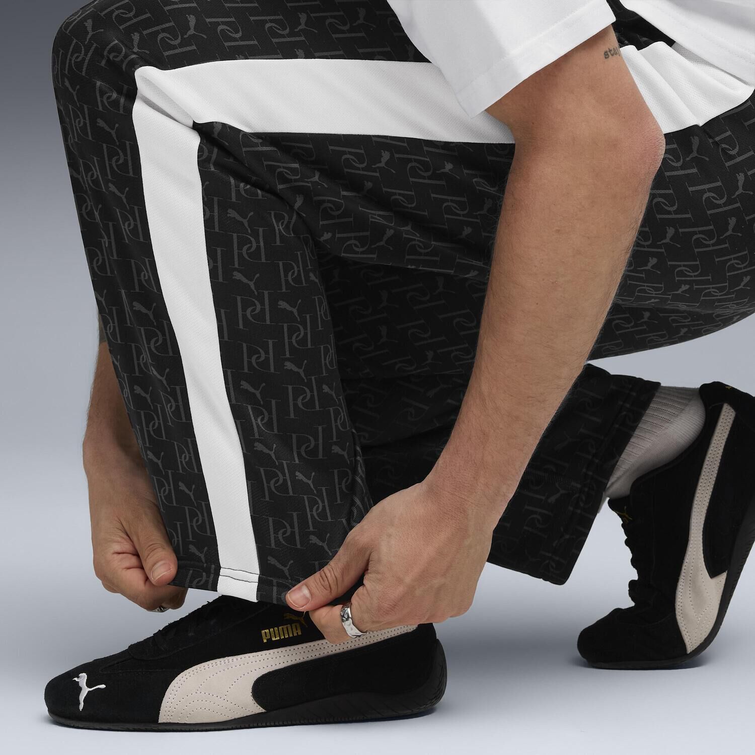 PUMA「【PUMA ｳｪｱ】M T7 AOP RELAXED TRACK PANTS」|チノ|