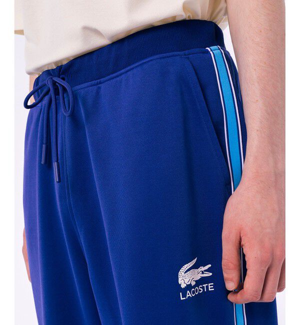 LACOSTE「サイドラインスウェットトラックパンツ」|チノ|