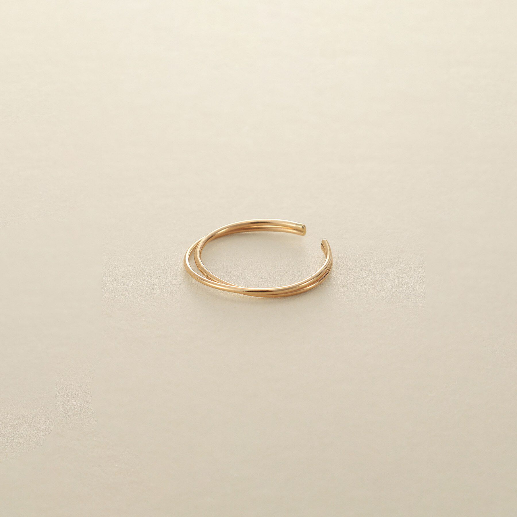 COCOSHNIK ONKITSCH「K10クロスイヤーカフ」|イヤリング|