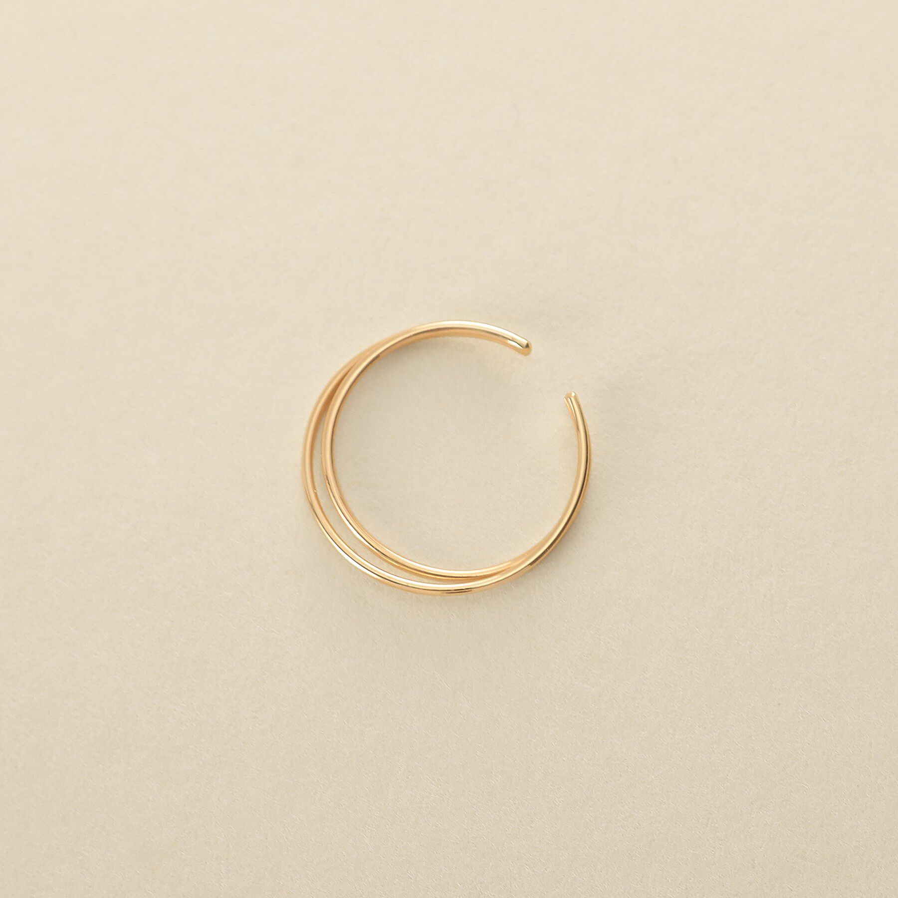 COCOSHNIK ONKITSCH「K10クロスイヤーカフ」|イヤリング|