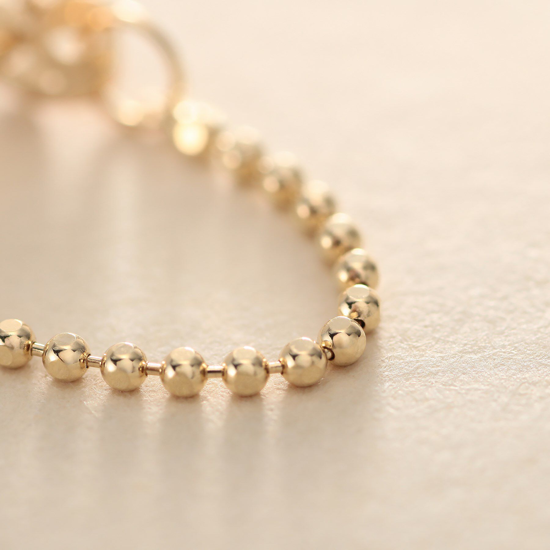 COCOSHNIK ONKITSCH「K10カットボールチェーン フープピアス」|ピアス|