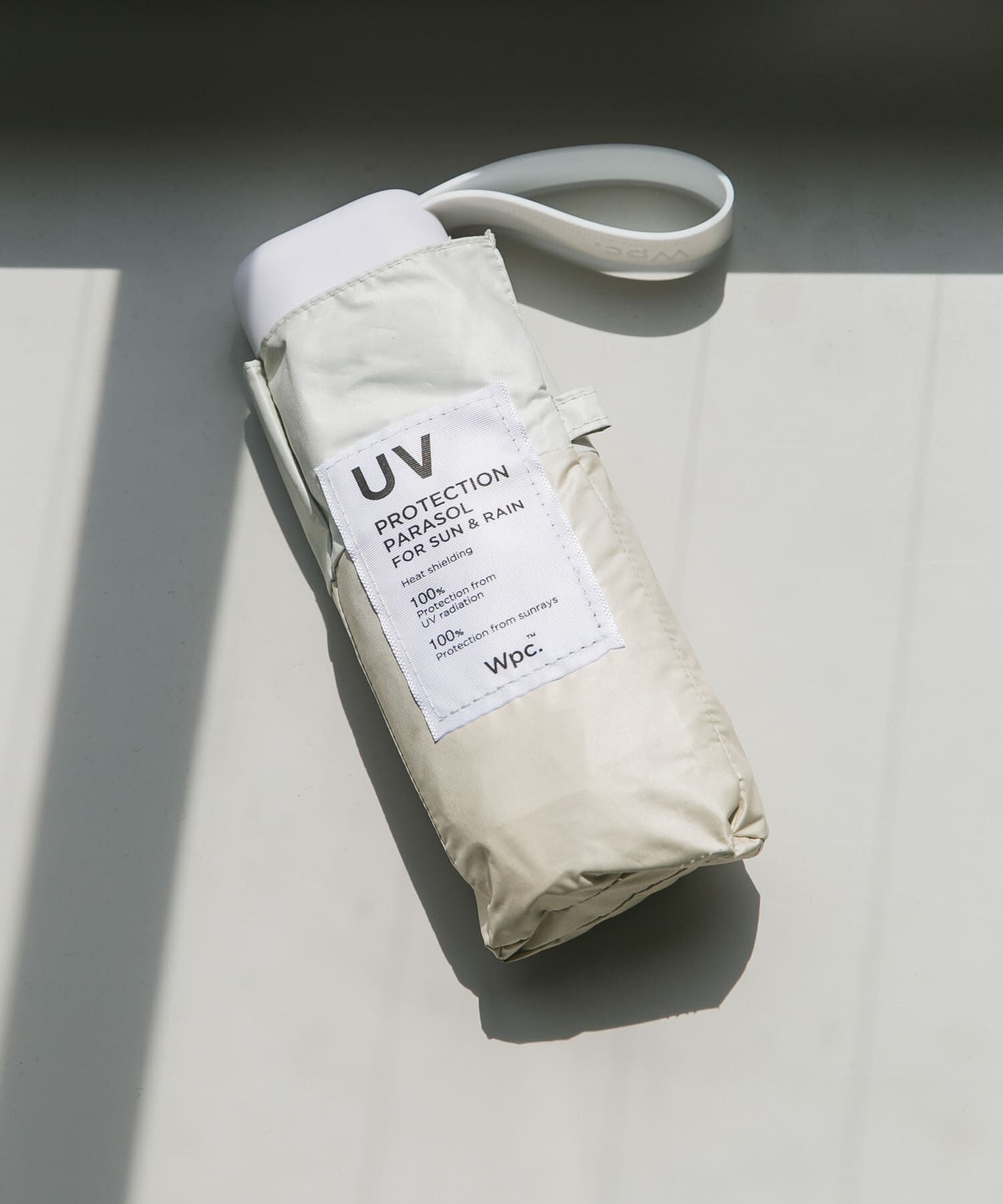 SMELLY「Wpc.　UV100%折り畳み傘」|傘|ベージュ