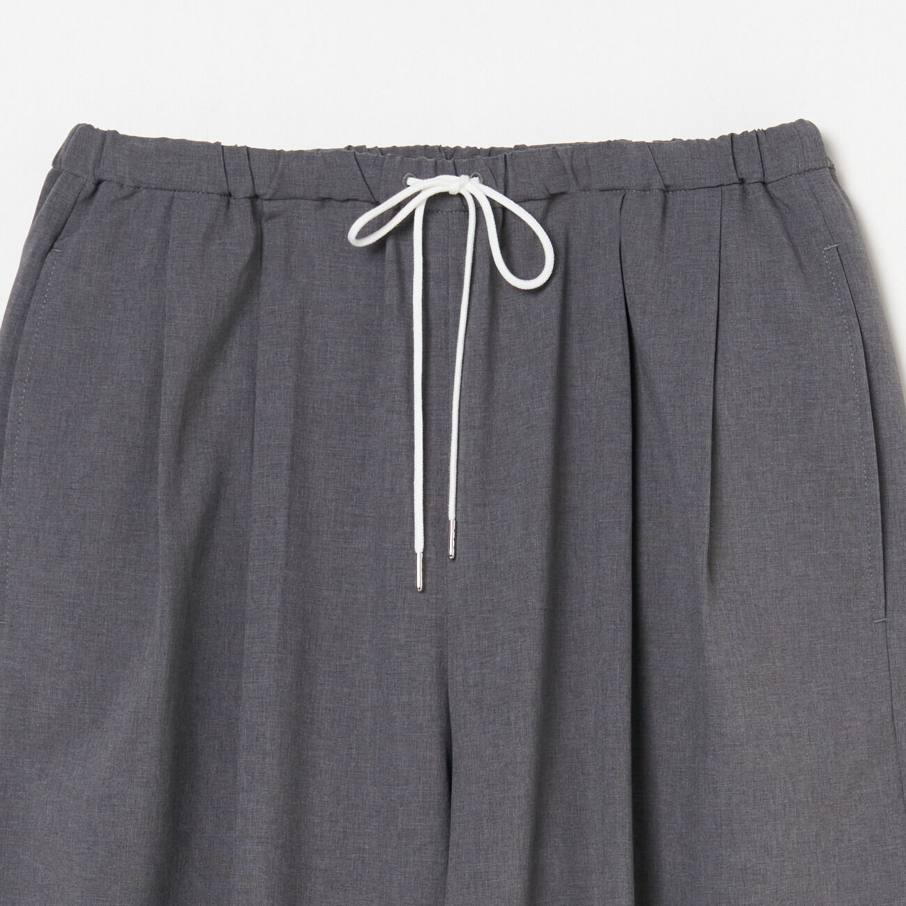 HELIOPOLE「HELIOPOLE BARREL LEG TUCK PANTS」|チノ|