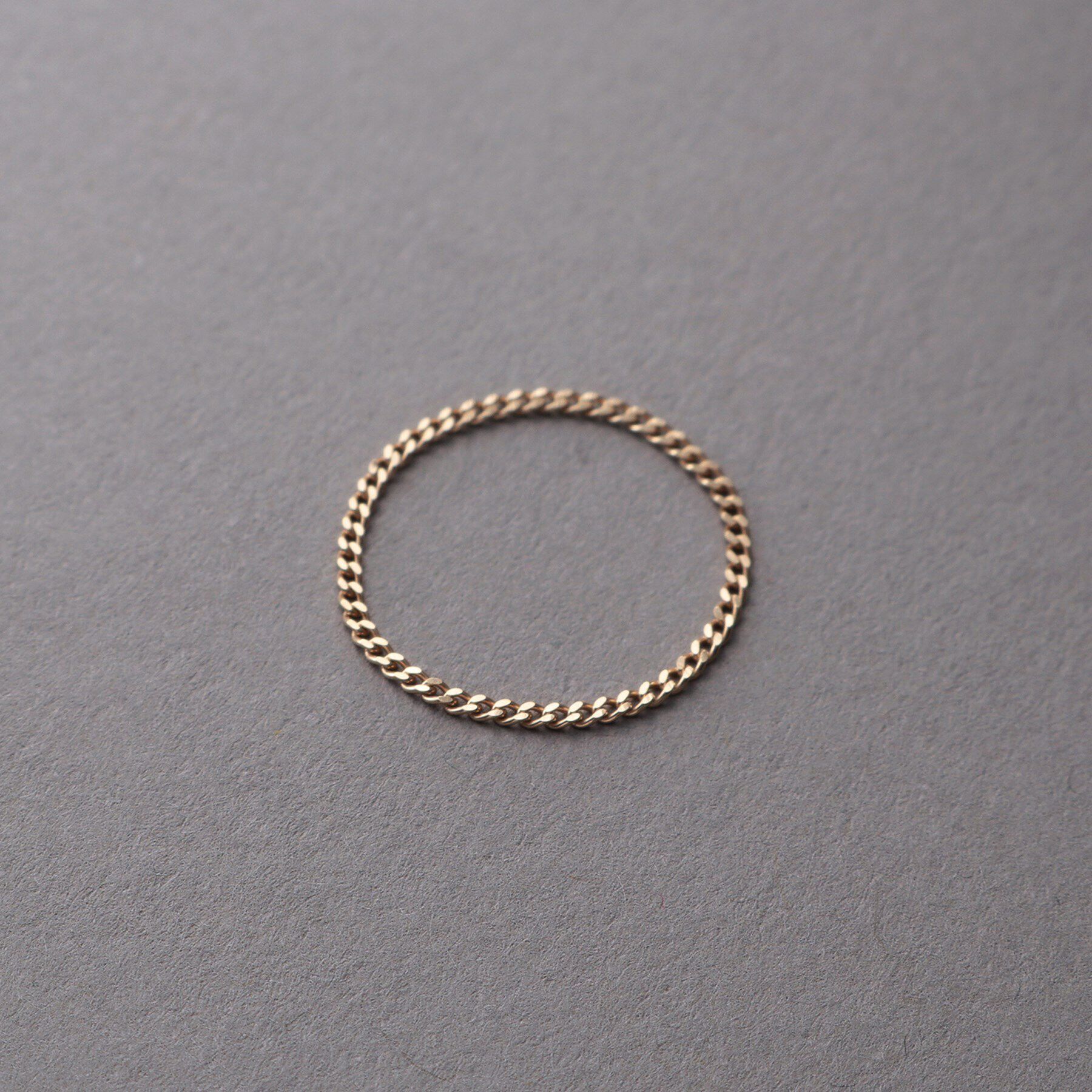 COCOSHNIK ONKITSCH「K10スキニーリング カーブチェーン」|リング|