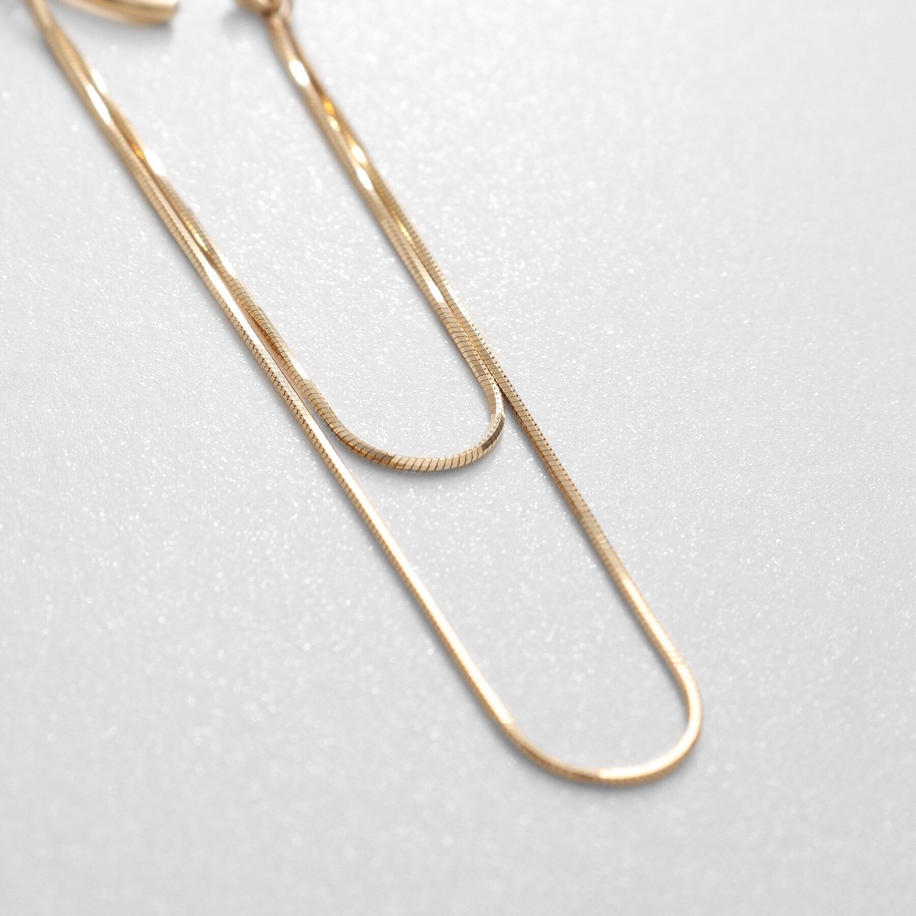 COCOSHNIK「K10コンパクトチェーン ドレープイヤーカフ」|イヤリング|