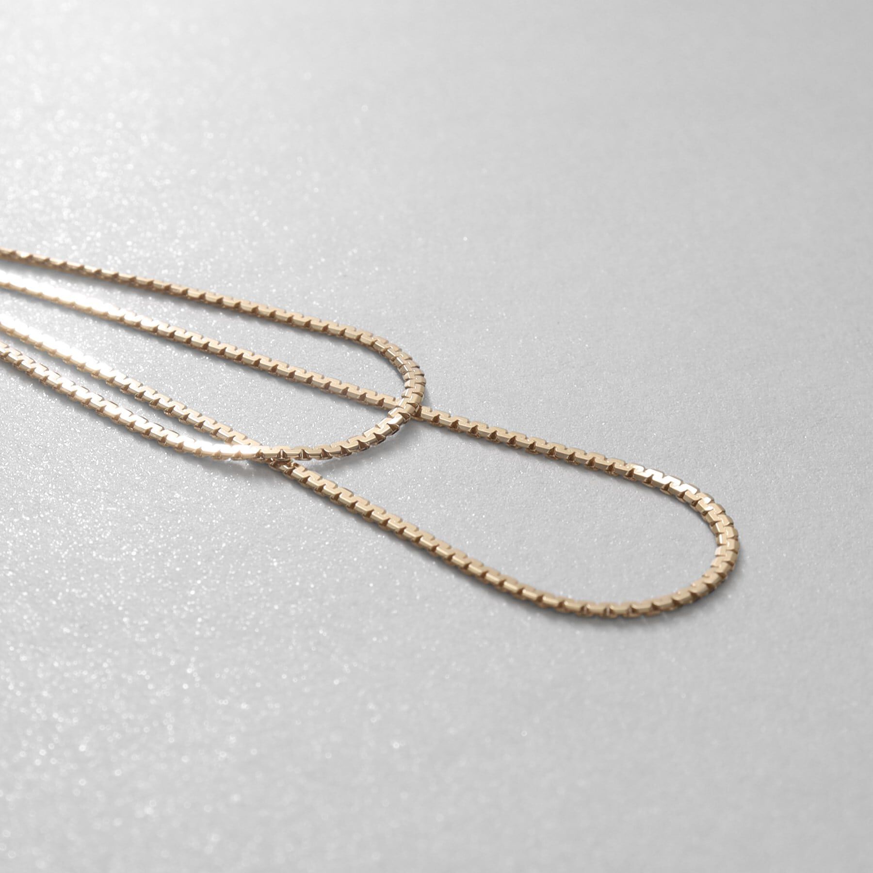 COCOSHNIK「K10ベネチアンフラットチェーンドレープ前後 スタッドピアス大」|ピアス|