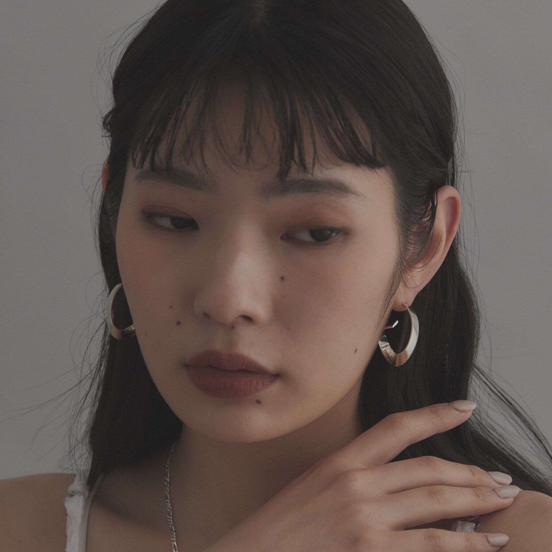 COCOSHNIK ONKITSCH「シルバー フォールディングピアス ストリーム」|ピアス|