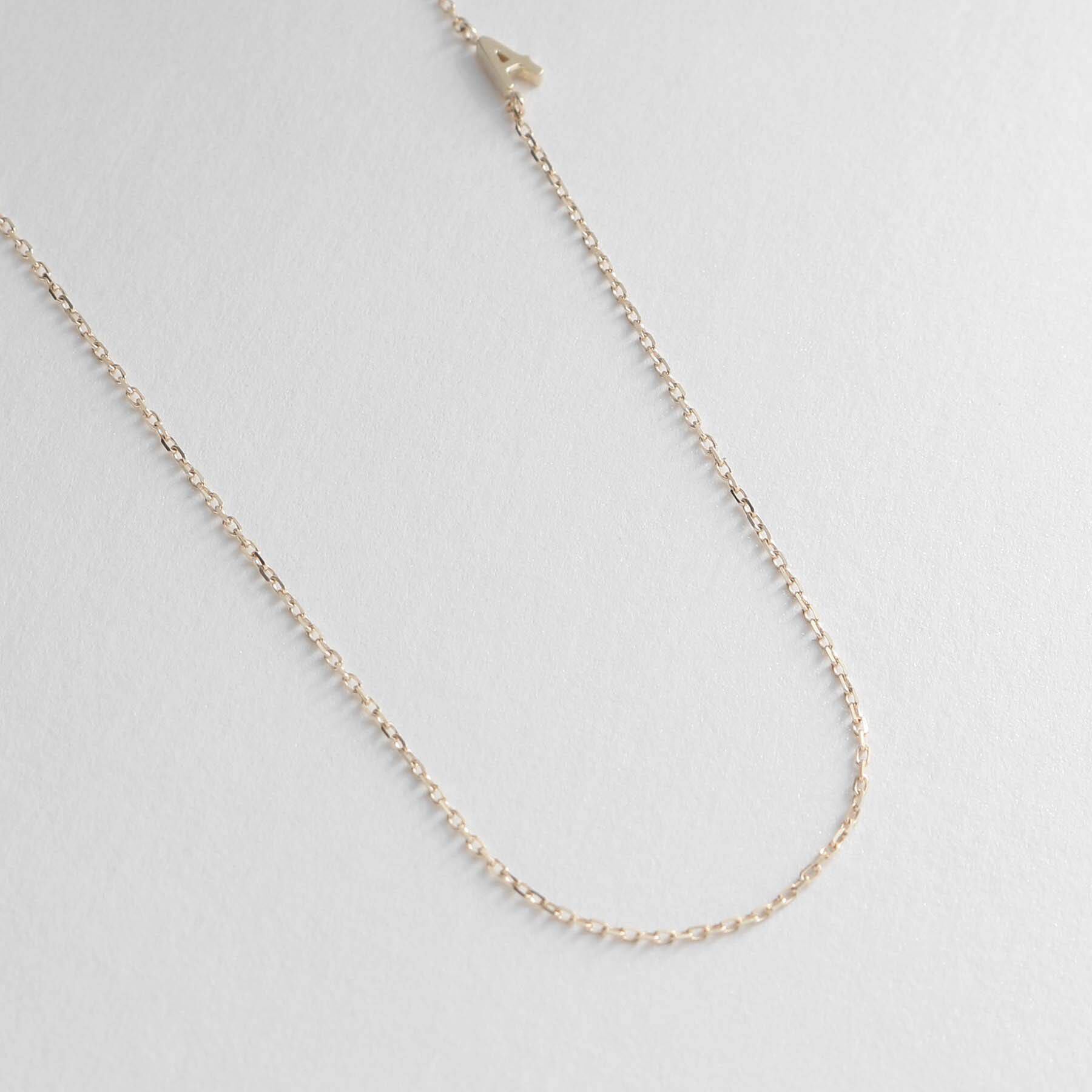 COCOSHNIK「【WEB限定】K10イニシャルＡ ネックレス」|ネックレス|