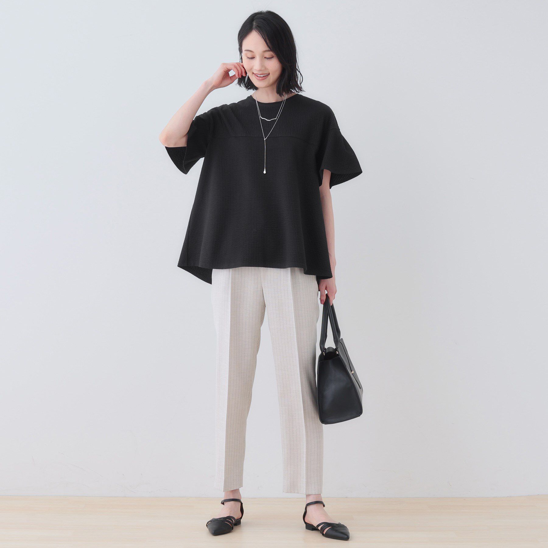 INDIVI「【洗える／体型カバー】凹凸素材フレアデザイントップス」|Tシャツ・カットソー|