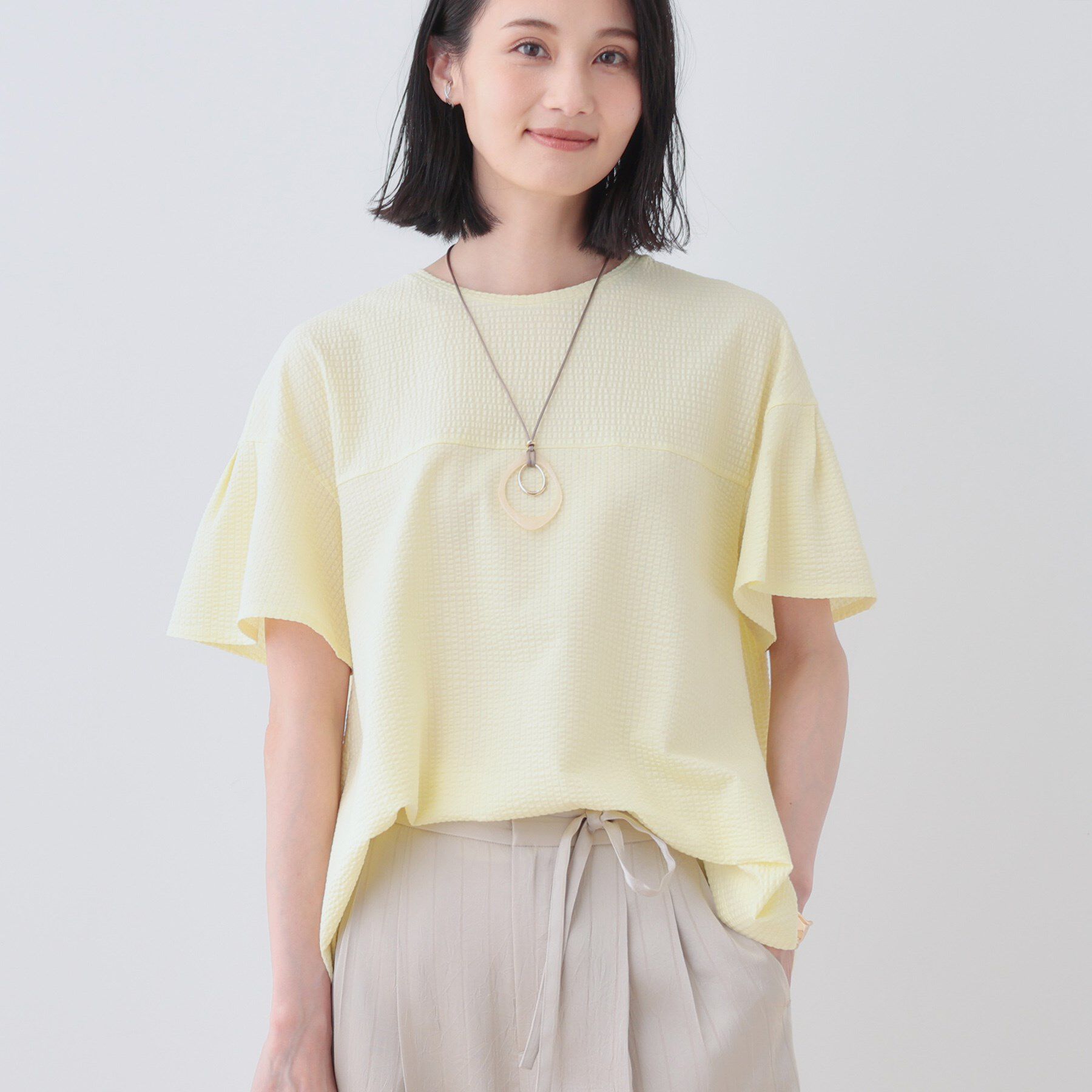 INDIVI「【洗える／体型カバー】凹凸素材フレアデザイントップス」|Tシャツ・カットソー|イエロー(031)