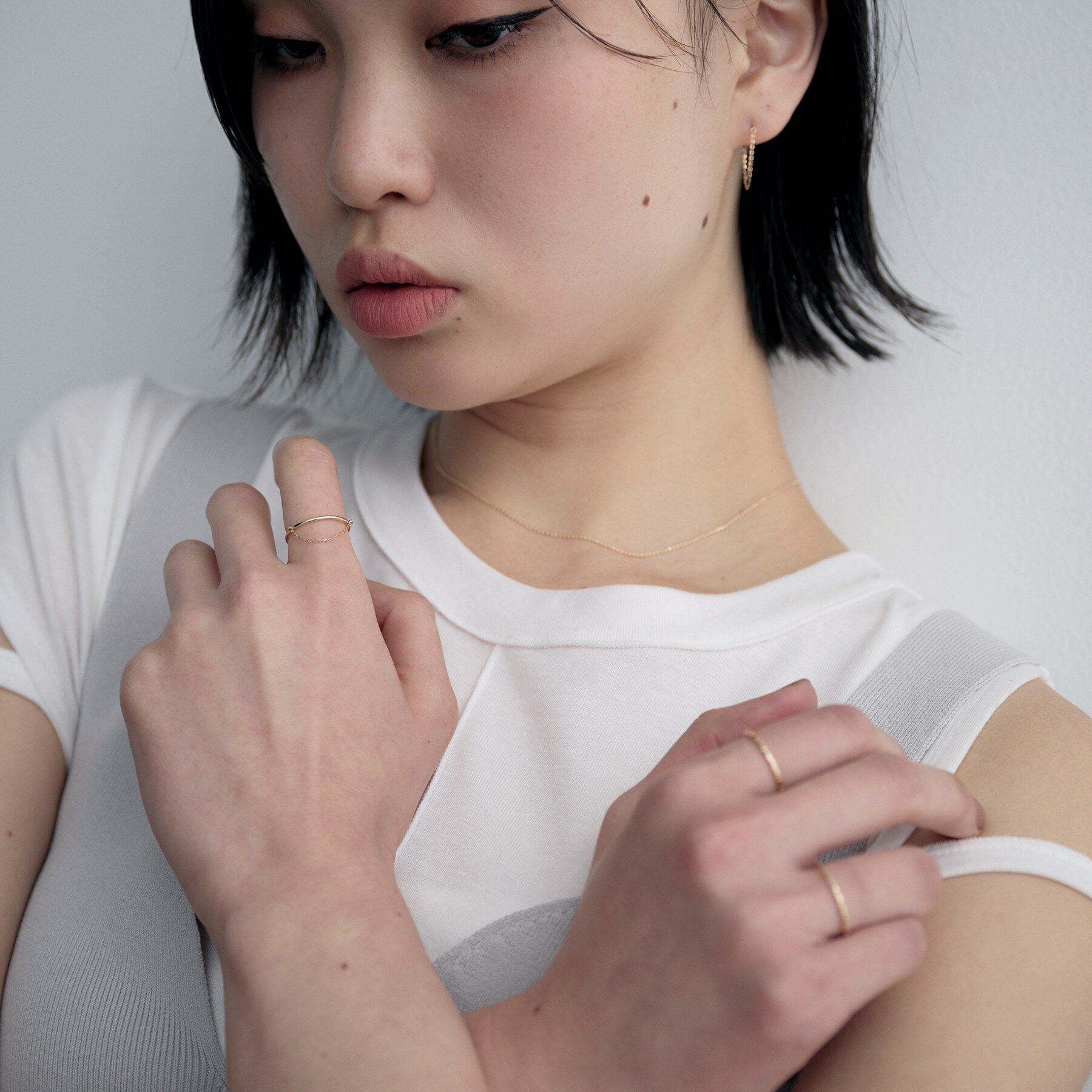 COCOSHNIK ONKITSCH「K10ミラーカットチェーン ドレープリング」|リング|