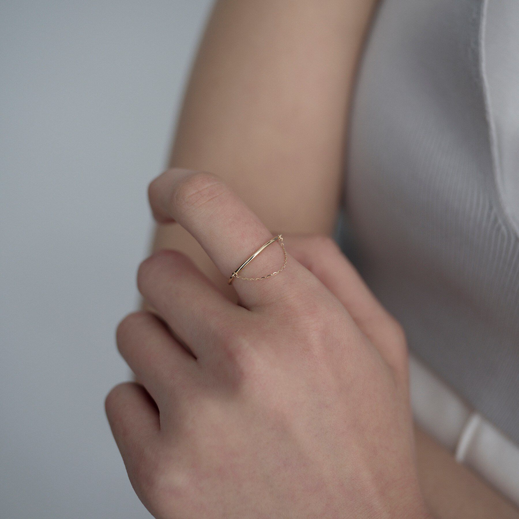 COCOSHNIK ONKITSCH「K10ミラーカットチェーン ドレープリング」|リング|