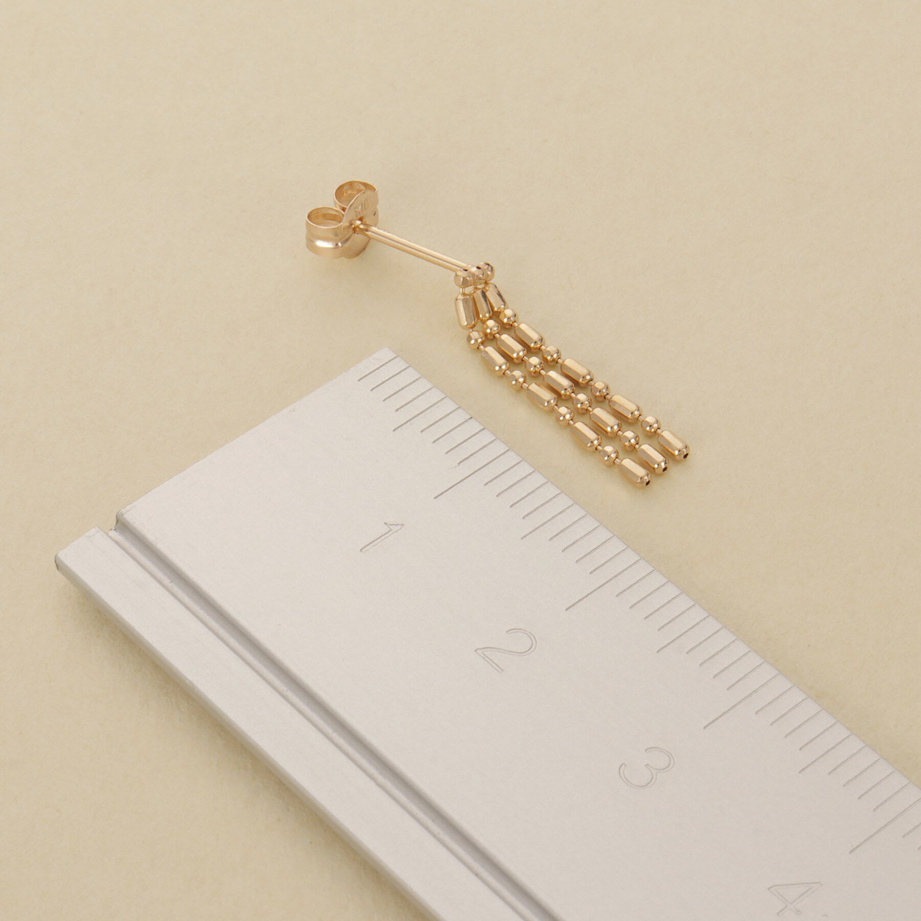 COCOSHNIK ONKITSCH「K10シリンダーチェーン フリンジピアス」|ピアス|