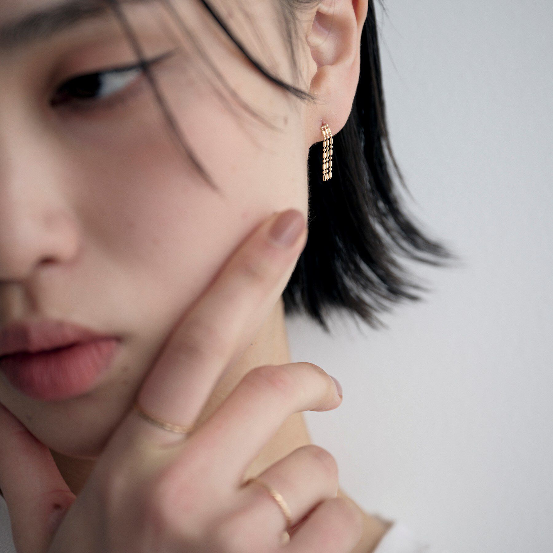 COCOSHNIK ONKITSCH「K10シリンダーチェーン フリンジピアス」|ピアス|