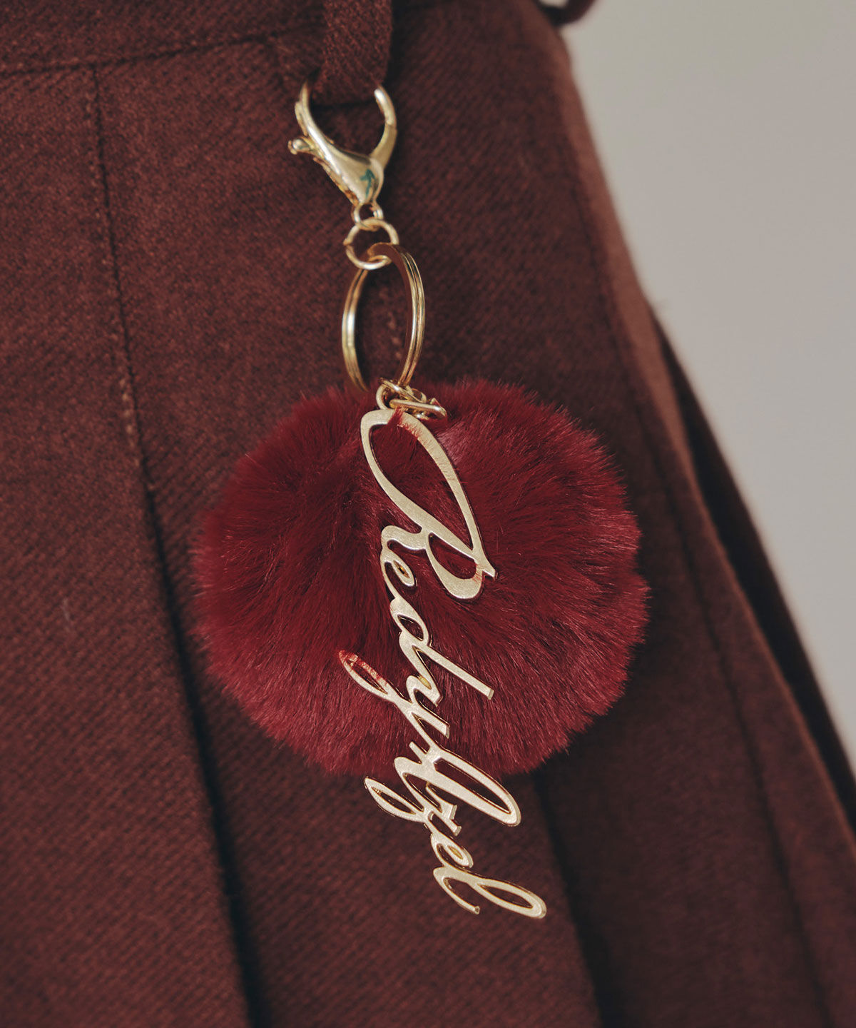 REDYAZEL「ファーチャームウールライクプリーツミニスカート」|フレア|