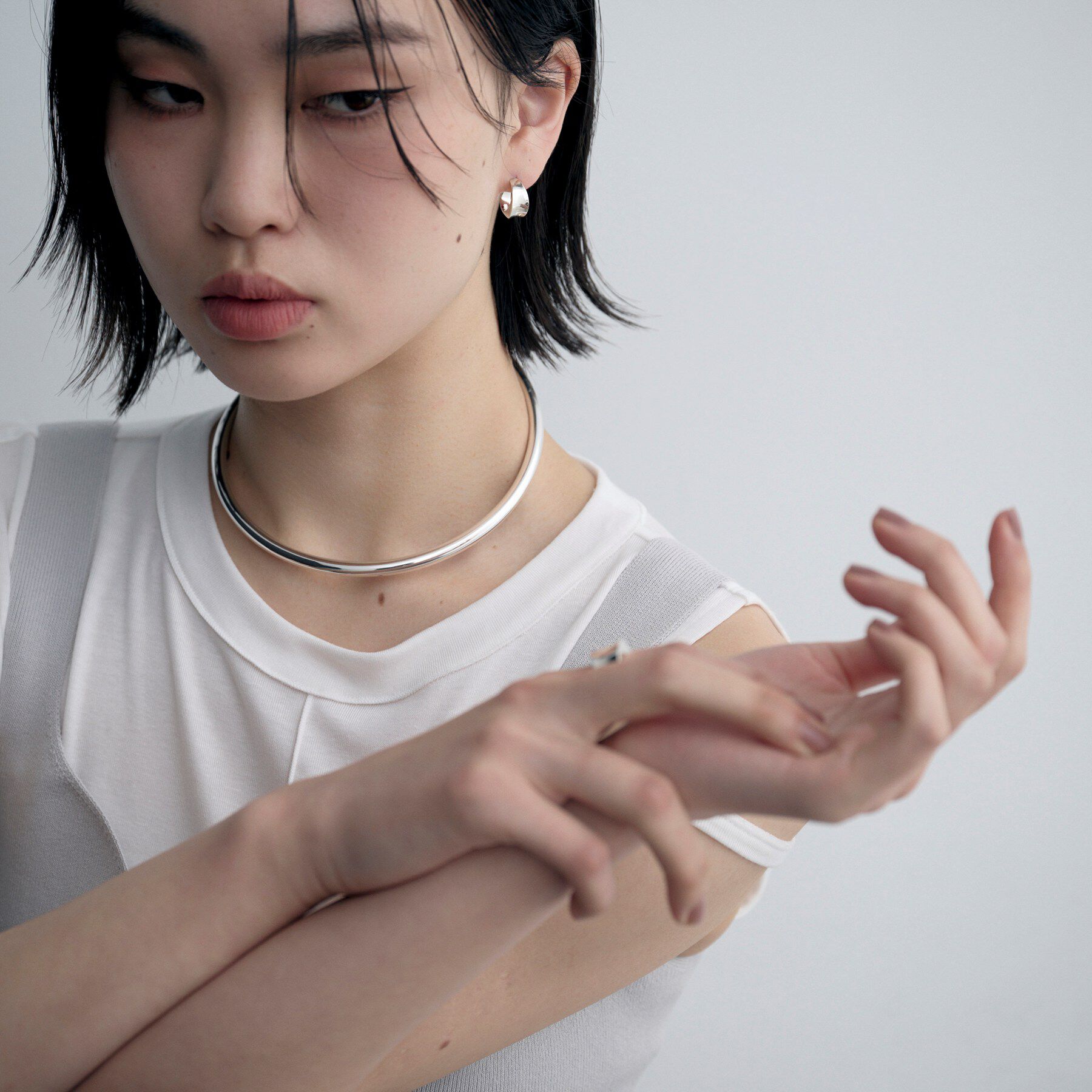 COCOSHNIK ONKITSCH「シルバー フローツイストピアス」|ピアス|