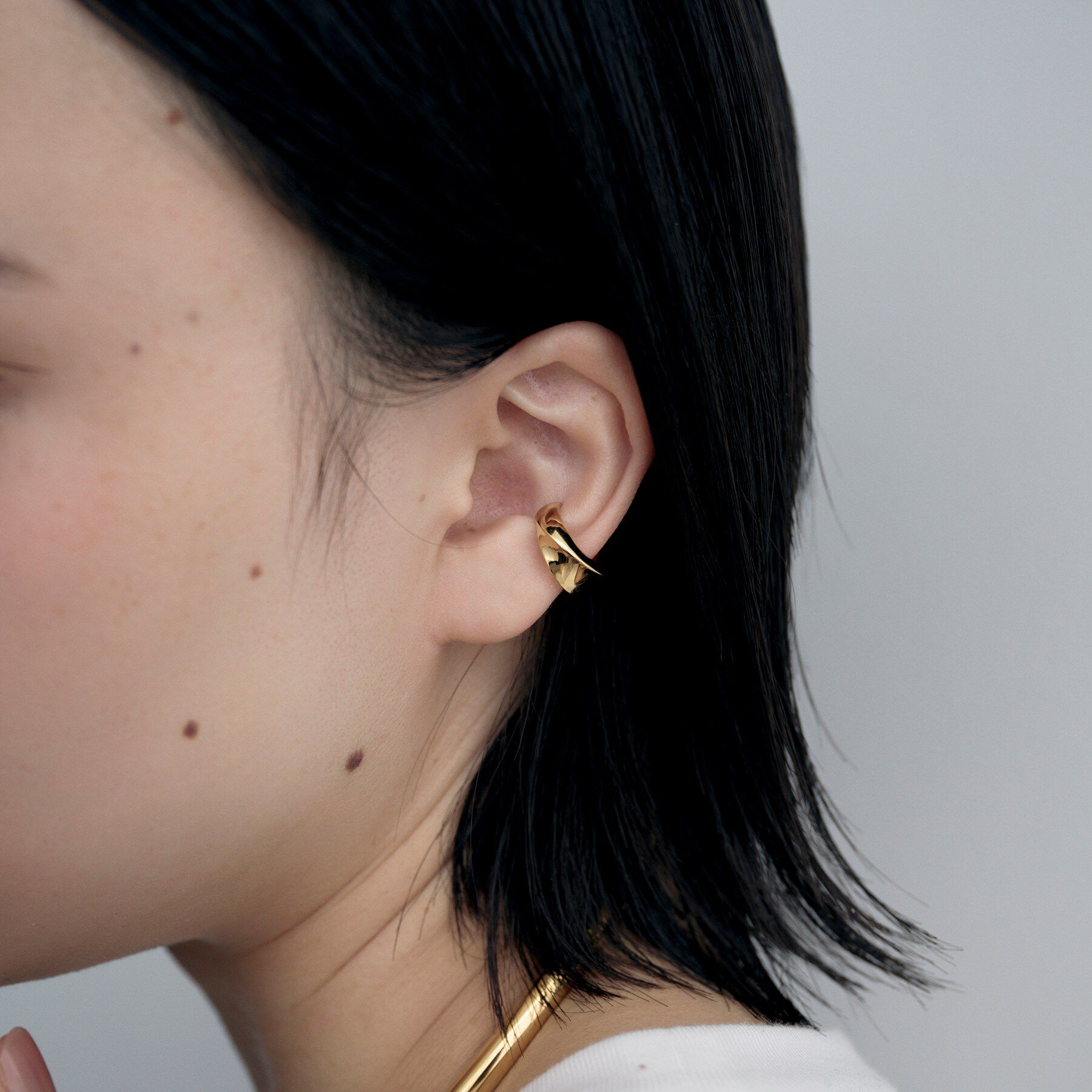 COCOSHNIK ONKITSCH「シルバー フローツイストイヤカフ GP」|イヤリング|