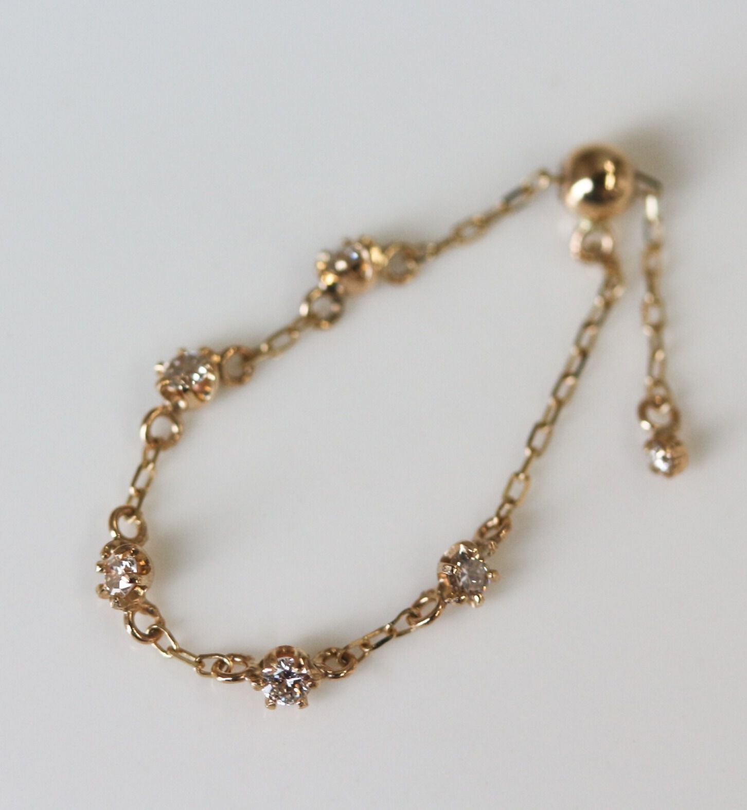  「ダイヤモンド ステーション チェーンリング | K10YG」|リング|