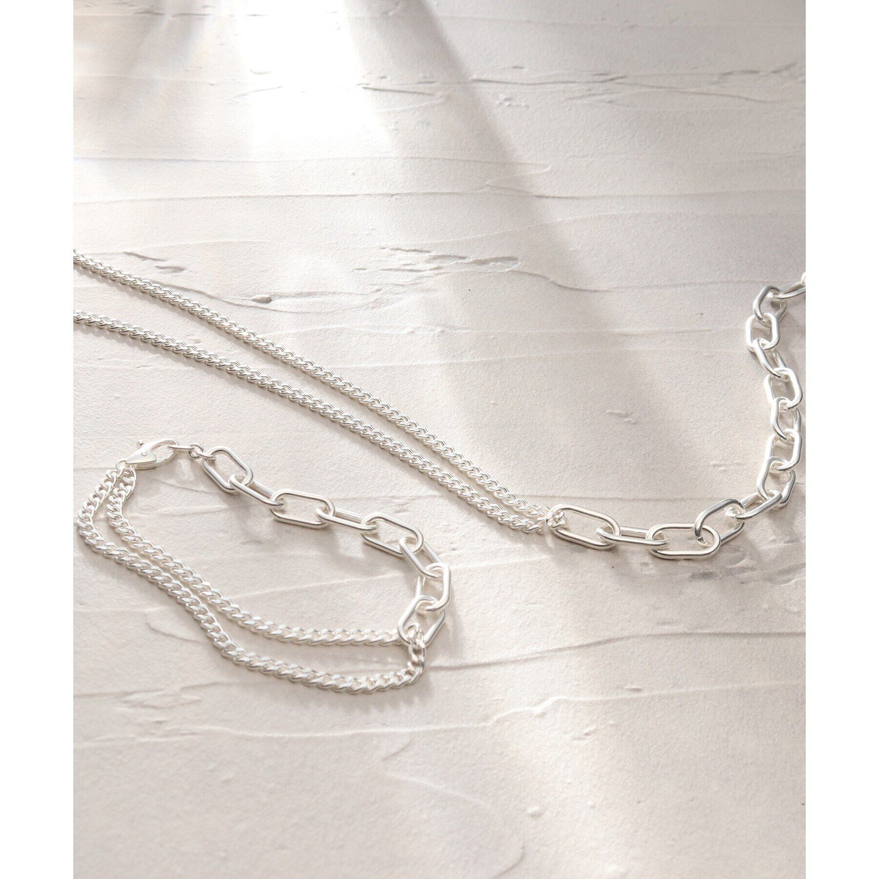 COCOSHNIK ONKITSCH「シルバー ミックスチェーン ケーブルカーブ ドレープ ネックレス」|ネックレス|